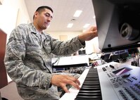 Senior Airman Dennis Lambert, pianist with Warhawk, the U.S. Air Force Band of the West ensemble, rehearses for an upcoming performance at Luke Air Force Base, Ariz. Warhawk was formed in 2003 and consists of highly-skilled professional musician-Airmen from across the United States. Warhawk travels more than 30,000 miles annually, and performs at venues throughout Texas, Arizona, New Mexico and Louisiana. The ensemble performs classic rock ‘n’ roll, traditional country and current pop music. (U.S. Air Force photo/Robbin Cresswell)