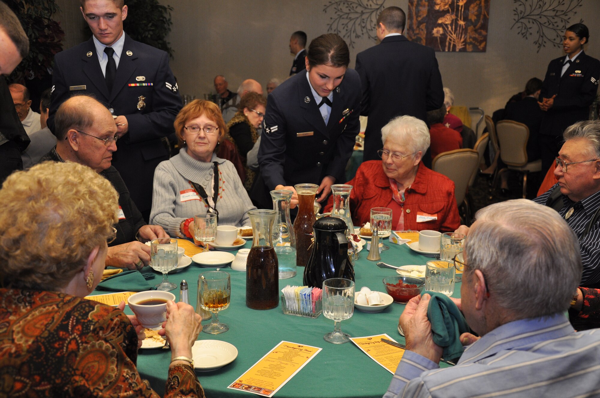 MINOT AIR FORCE BASE, N.D. -- A Team Minot Airman serves senior citizens as part of the annual Day of Love event held at the Jimmy Doolittle Center here, Nov. 24. The Day of Love celebration began in 1969 as a function to provide for the senior citizens, and to involve base personnel who were away from their families, in a celebration of Thanksgiving. (U.S. Air Force photo/ Senior Airman Jessica McConnell)