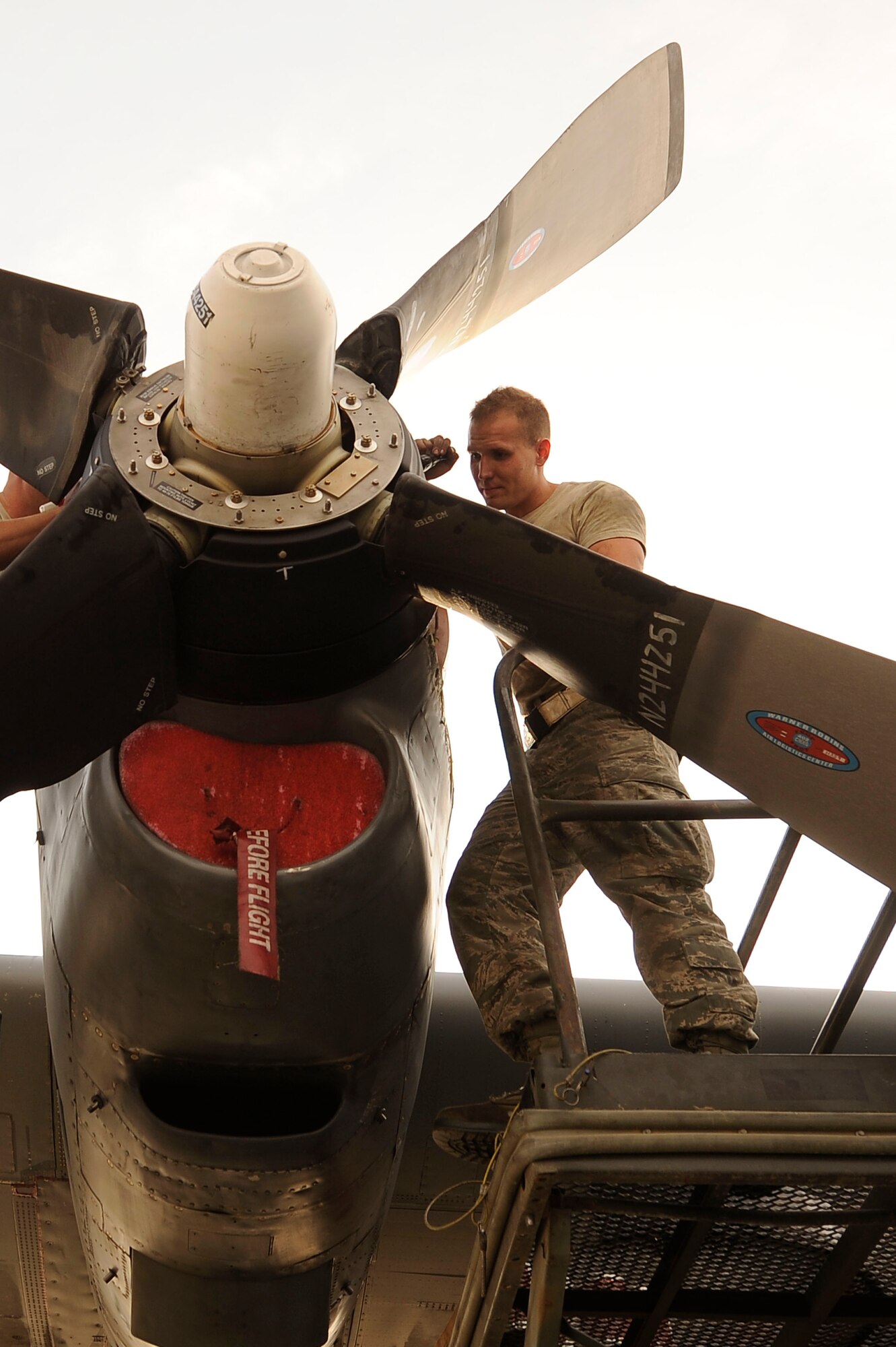BAGRAM AIRFIELD, Afghanistan – Senior Airman Christopher Scott, 455th  Expeditionary Aircraft Maintenance Squadron aerospace propulsion journeyman, conducts an inspection on an EC-130H Compass Call propeller Nov. 23, 2011. After installing the propeller, Scott inspects to ensure all parts are installed correctly before to avoid malfunctions. (U.S. Air Force photo/ Senior Airman Krista Rose)