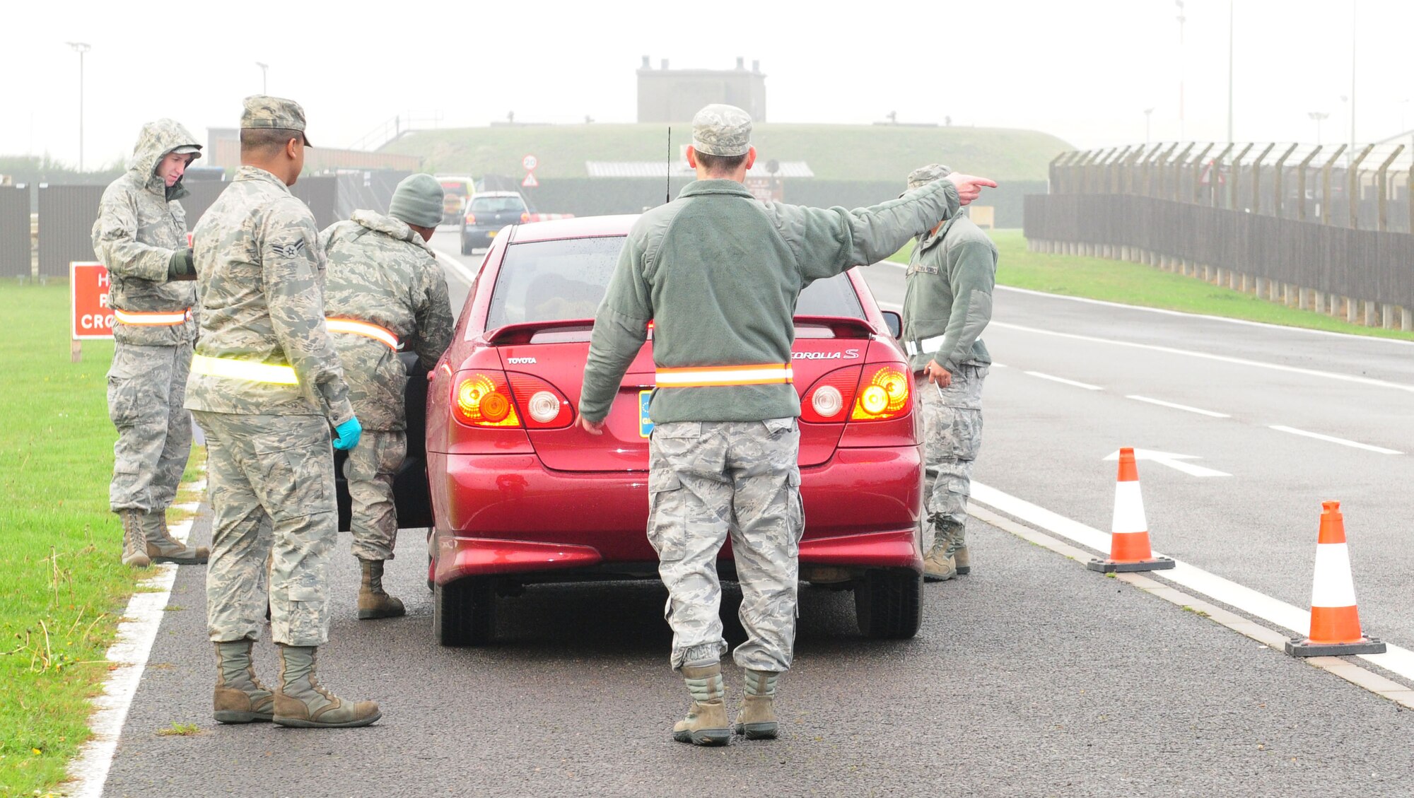 RAF MILDENHALL, England -- Airmen from the 100th Logistics Readiness Squadron and 100th Air Refueling Wing Safety office perform winter safety checks on a vehicle here Nov. 22, 2011, along the perimeter road. Working in conjunction with Ministry of Defence Police, the checks were performed at RAF Mildenhall and RAF Lakenheath as part of Road Safety Week. Vehicles were randomly stopped, information leaflets were handed out, and the vehicle maintenance and safety personnel used checklists to inspect items including tires, wipers and lights. (U.S. Air Force photo/Karen Abeyasekere)