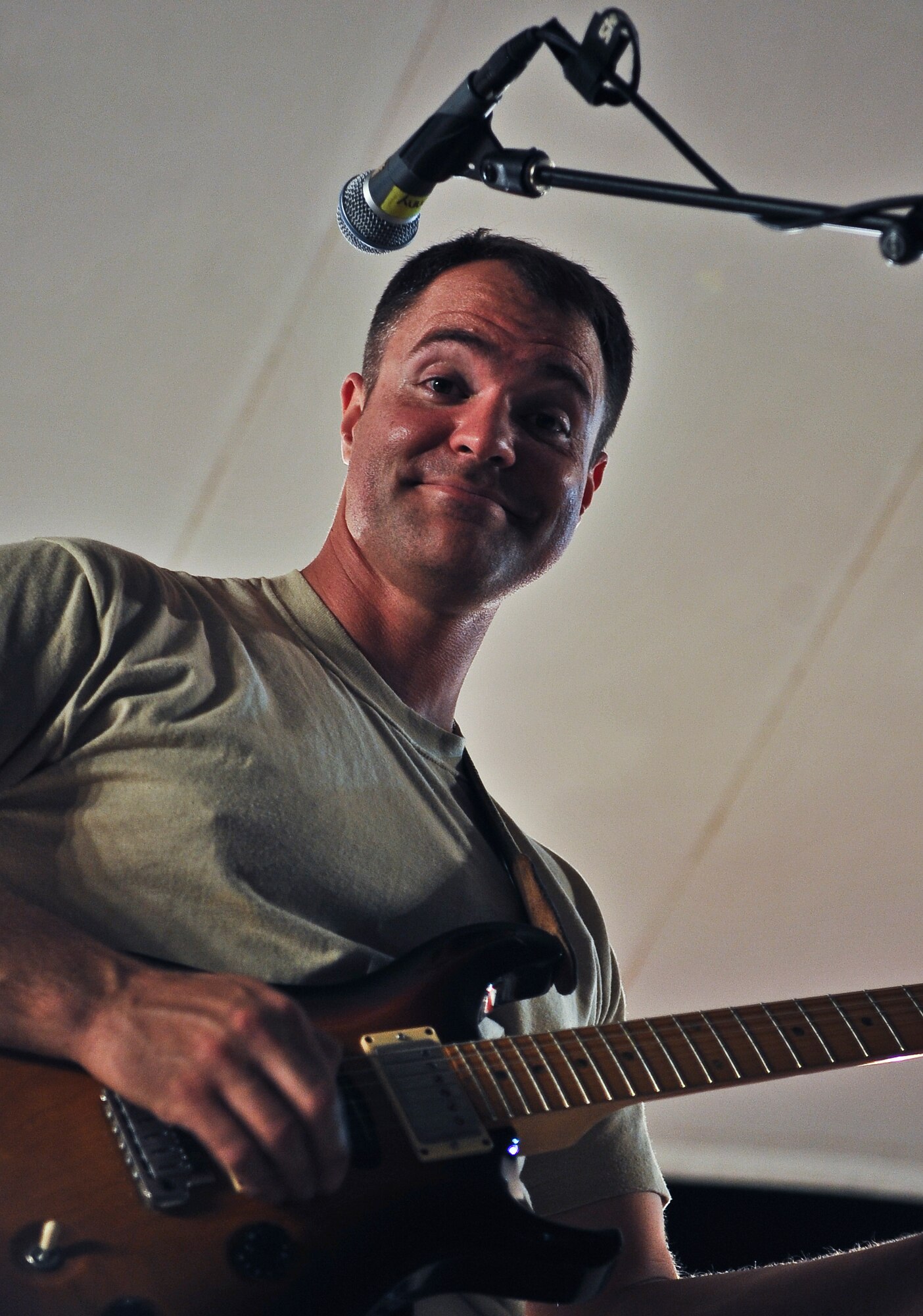 Tech. Sgt. Dennis Pack, U.S. AFCENT band ‘Top Cover’ NCO in charge and guitarist, performs during a farewell concert at the Memorial Plaza Nov. 25, 2011, at an undisclosed location in Southwest Asia. During its deployment, the band toured seven countries and made more than 80 appearances, playing such songs as “Forget you” by Cee-Lo Green, “R.E.S.P.E.C.T” by Aretha Franklin, “Don’t Stop Believing” by Journey and “Freebird” by Lynyrd Skynyrd. Pack, a native of Twin Falls, Id., is deployed from Joint Base Elmendorf-Richardson, Alaska. (U.S. Air Force photo/Senior Airman Paul Labbe)