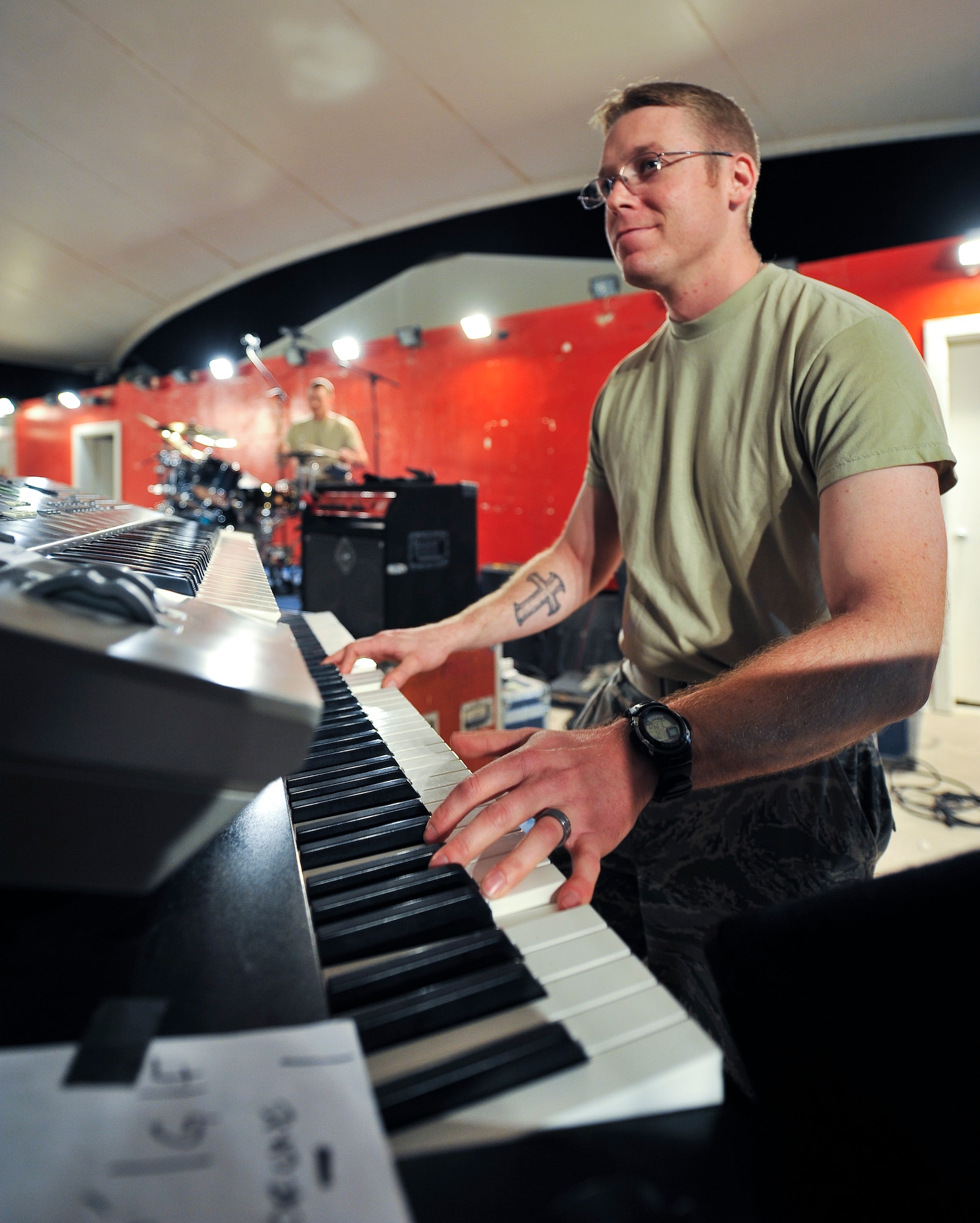 Staff Sgt. Shane Spanier, U.S. Air Forces Central Command band ‘Top Cover’ keyboardist, performs during a farewell concert at the Memorial Plaza Nov. 25, 2011, at an undisclosed location in Southwest Asia.  During its deployment, the band toured seven countries and made more than 80 appearances, playing such songs as “Forget you” by Cee-Lo Green, “R.E.S.P.E.C.T” by Aretha Franklin, “Don’t Stop Believing” by Journey and “Freebird” by Lynyrd Skynyrd. Spanier, a native of Atwood, Kan., is deployed from Joint Base Elmendorf-Richardson, Alaska. (U.S. Air Force photo/Senior Airman Paul Labbe)