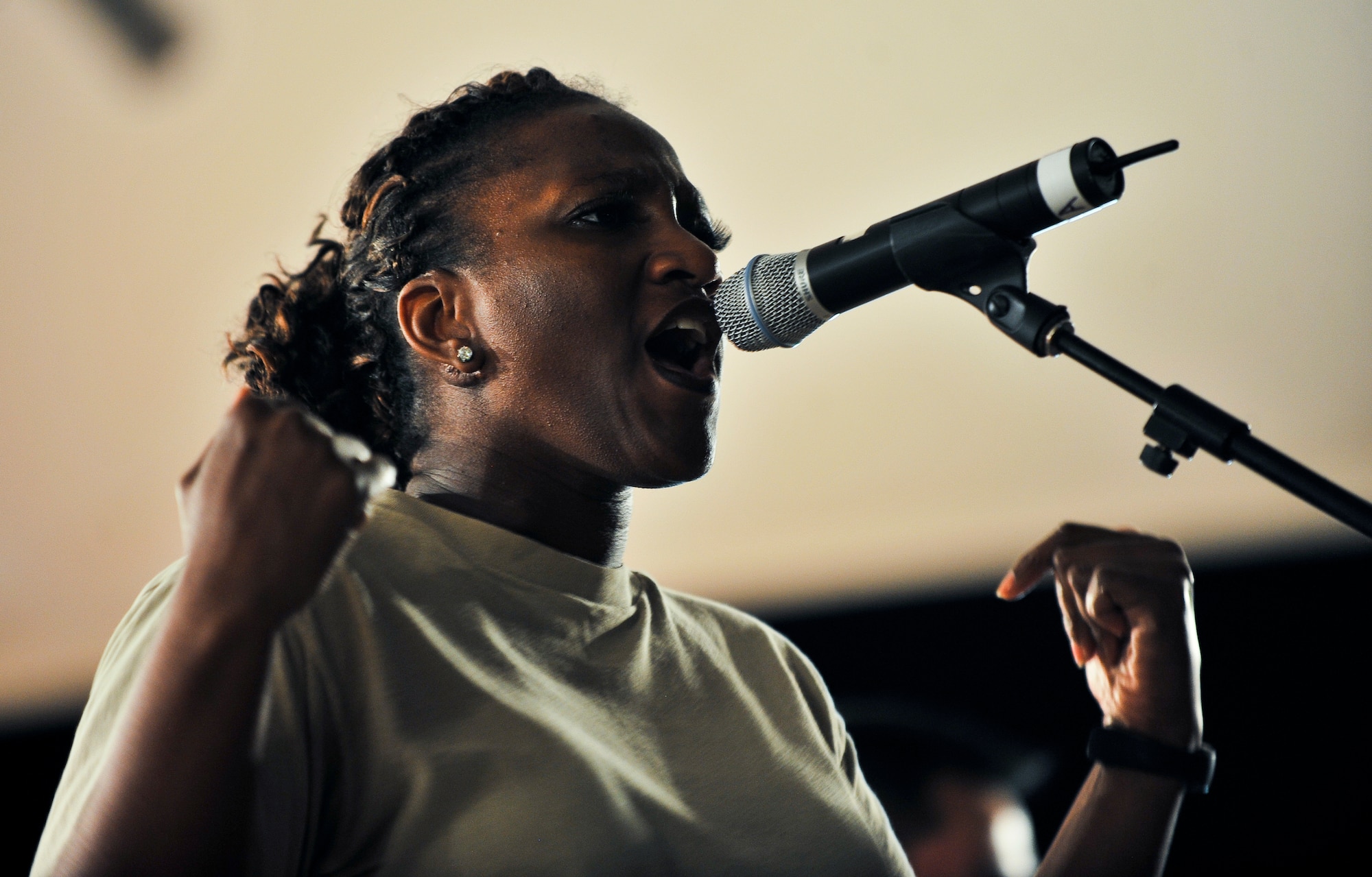 Tech. Sgt. Amber Grimes, U.S. Air Forces Central Command band ‘Top Cover’ lead vocalist, performs during a farewell concert at the Memorial Plaza Nov. 25, 2011, at an undisclosed location in Southwest Asia. During its deployment, the band toured seven countries and made more than 80 appearances, playing such songs as “Forget you” by Cee-Lo Green, “R.E.S.P.E.C.T” by Aretha Franklin, “Don’t Stop Believing” by Journey and “Freebird” by Lynyrd Skynyrd. Grimes, a native of Columbus, Ga., is deployed from Joint Base Elmendorf-Richardson, Alaska. (U.S. Air Force photo/Senior Airman Paul Labbe)
