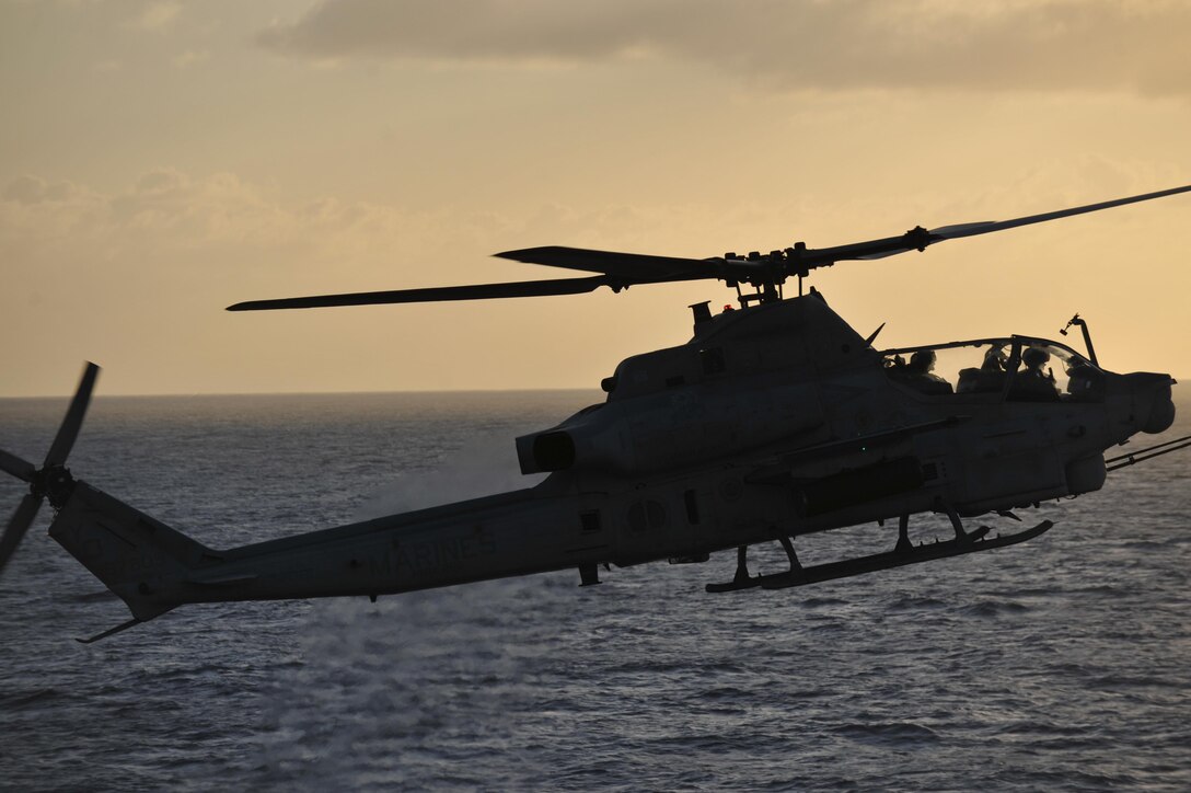 An AH-1Z Super Cobra with the 11th Marine Expeditionary Unit's aviation combat element, Marine Medium Helicopter Squadron 268 (Reinforced), lands aboard USS Makin Island here Nov. 28. The unit embarked USS Makin Island, USS New Orleans and USS Pearl Harbor in San Diego Nov. 14 to begin a seven-month deployment through the Western Pacific and Middle East regions.