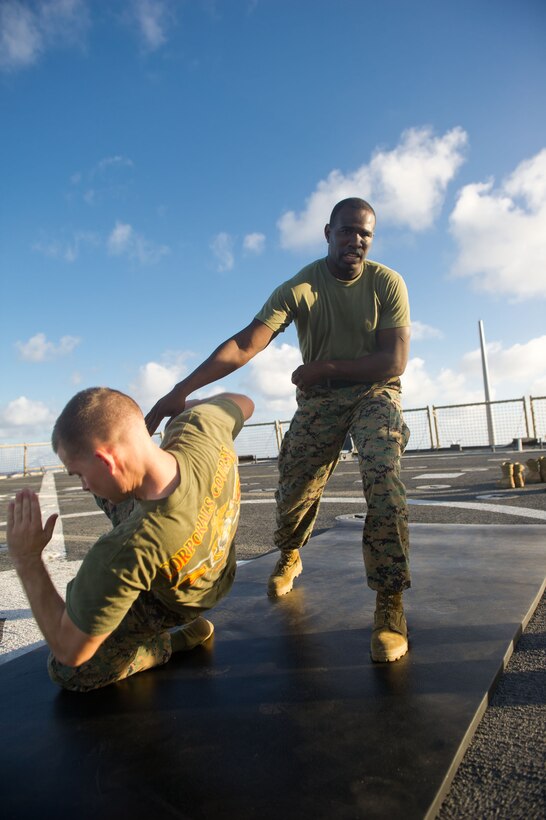 Warehouse chief Sgt. Emmanuel M. Boyd demonstrates a technique during martial arts training aboard USS Pearl Harbor here Nov. 28. Boyd, 29, hails from Fort Lauderdale, Fla., and serves with Battalion Landing Team 3/1. The battalion is the ground combat element for the 11th Marine Expeditionary Unit, which embarked USS Makin Island, USS New Orleans and USS Pearl Harbor in San Diego Nov. 14, beginning a seven-month deployment to the Western Pacific and Middle East regions.