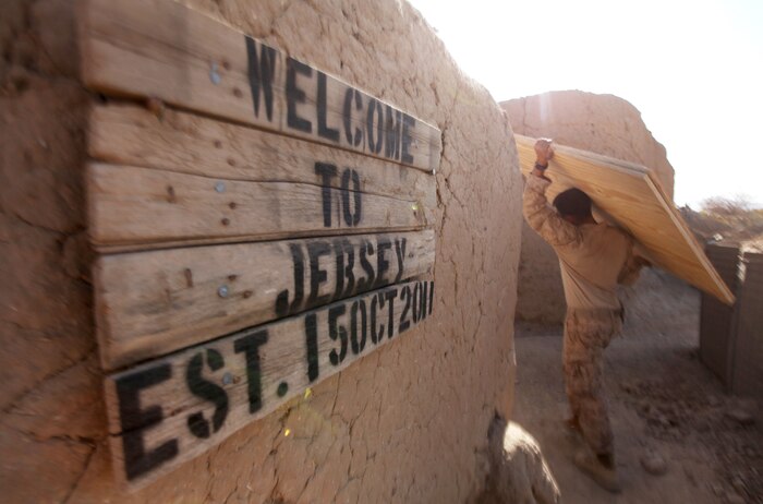 A Marine with 2nd Engineer Platoon, Combat Logistics Company 6, hauls building materials at Patrol Base New Jersey, Afghanistan, Nov. 23. The company, which is comprised of two engineer platoons and one motor transportation platoon, is an element of Combat Logistics Battalion 6, 2nd Marine Logistics Group (Forward), and was formed to provide direct support to 1st Battalion, 6th Marine Regiment, during Operation Eastern Storm. CLC-6 engineers built several of the patrol bases along Route 611. (U.S. Marine Corps photo by Sgt. Justin J. Shemanski)