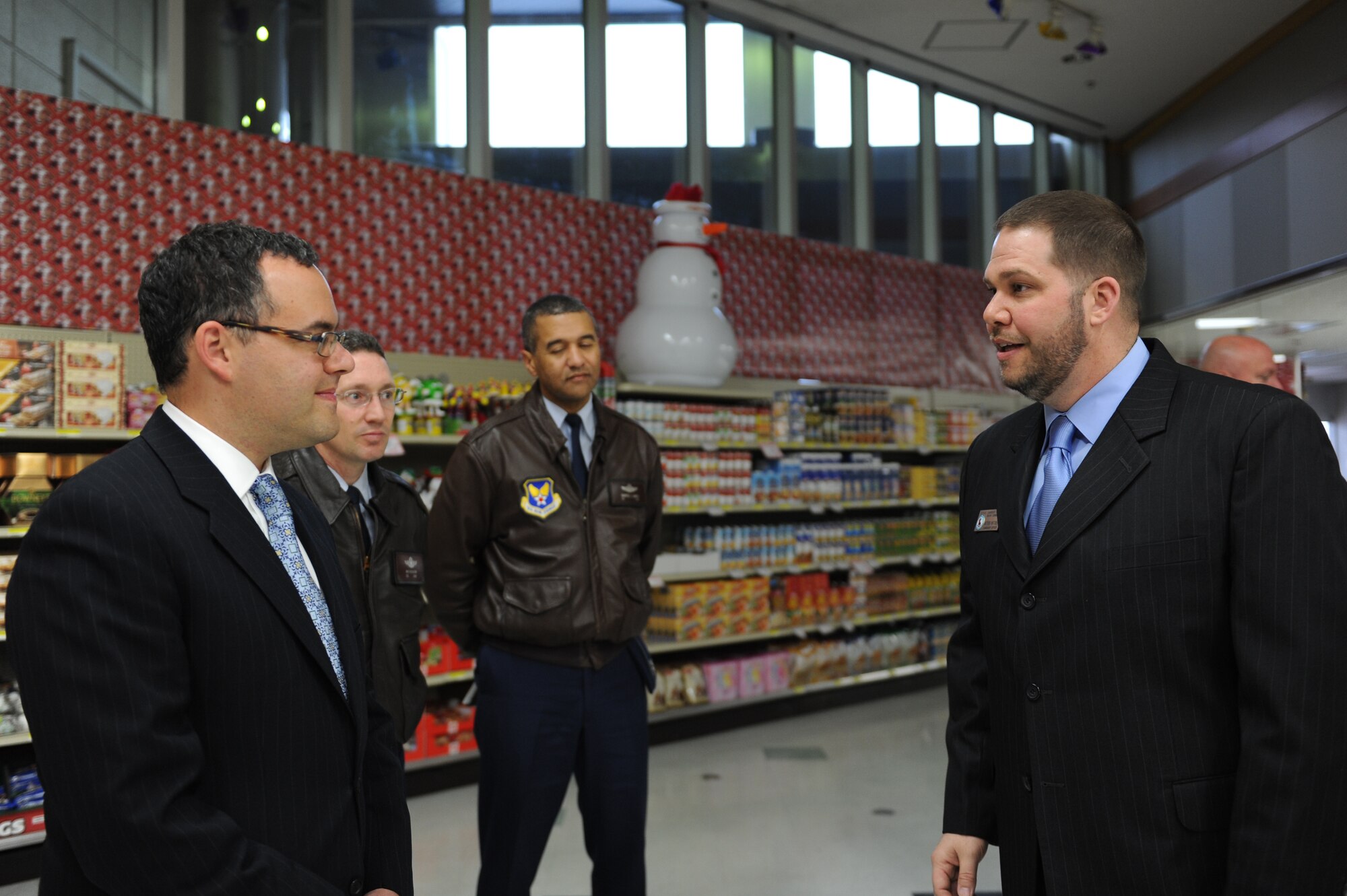 MISAWA AIR BASE, Japan – From left to right, Daniel B. Ginsberg, Assistant Secretary of the Air Force for Manpower and Reserve Affairs, Col. Michael D. Rothstein, 35th Fighter Wing commander, Col. Darryle Grimes, Senior Military Assistant to the Secretary of the Air Force for Manpower and Reserve Affairs, and Matthew Whitaker, Defense Commissary Agency, discuss the money Misawa Air Base Community saves on average by shopping at the commissary Nov. 28. Ginsberg visited base facilities and expressed his gratitude to the Misawa community for their efforts during Operation Tomodachi. (U.S. Air Force Photo/Airman 1st Class Kia Atkins)