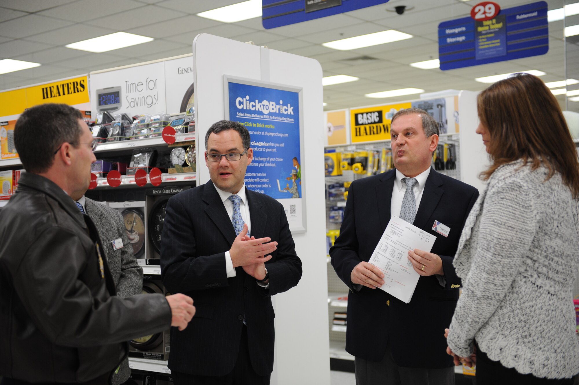 MISAWA AIR BASE, Japan – From left to right, Col. Michael D. Rothstein, 35th Fighter Wing commander, Daniel B. Ginsberg, Assistant Secretary of the Air Force for Manpower and Reserve Affairs, Doug Vasalech, The Exchange general manager, and Kim Neiss, store manager, talk about savings at The Exchange during a base visit here Nov. 28. Ginsberg visited base facilities and expressed his gratitude to the Misawa community for their efforts during Operation Tomodachi. (U.S. Air Force Photo/Airman 1st Class Kia Atkins)