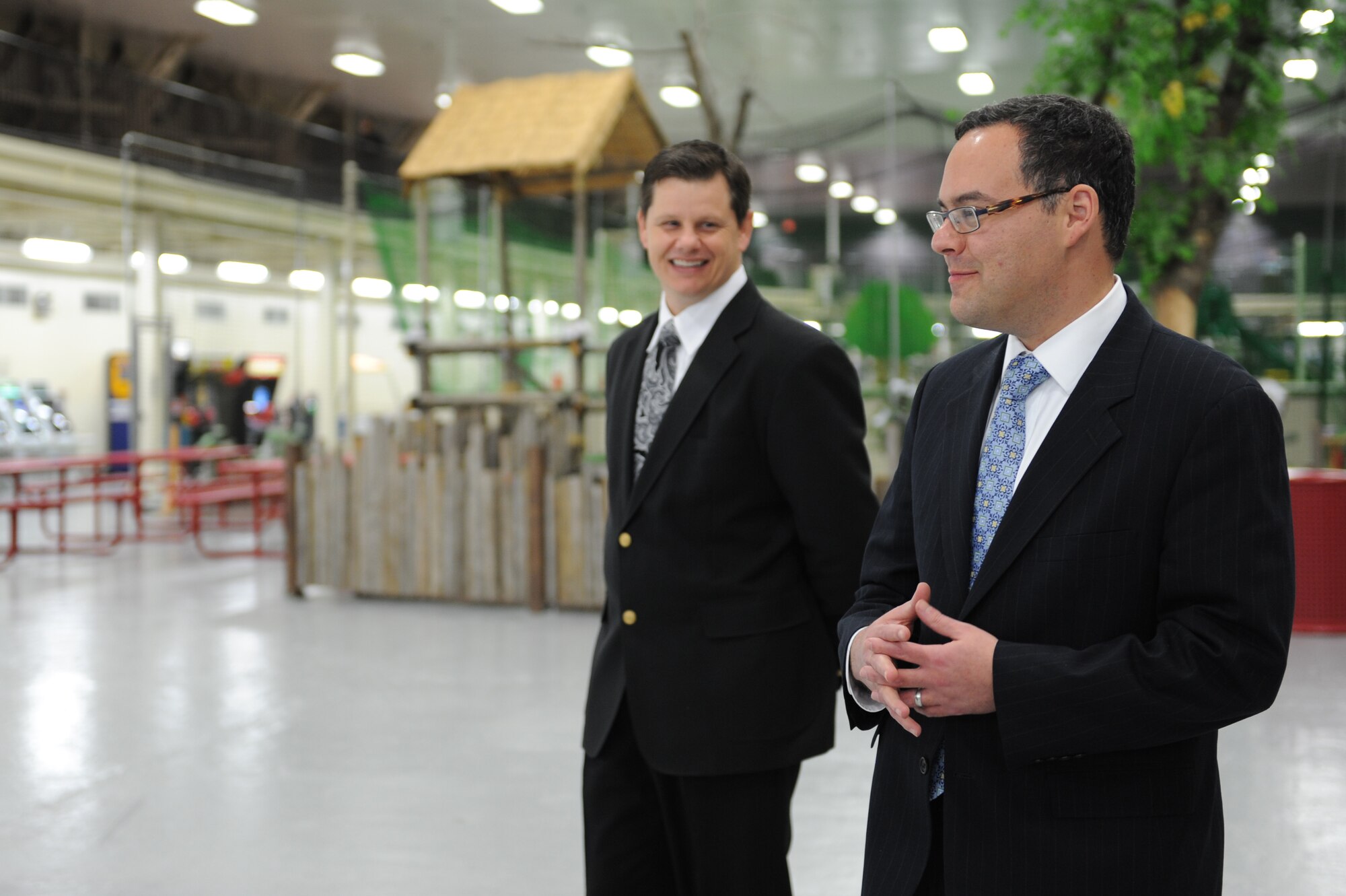 MISAWA AIR BASE, Japan – Blaine Miller, left, 35th Force Support Squadron, and Daniel B. Ginsberg, Assistant Secretary of the Air Force for Manpower and Reserve Affairs, talk about the Weasels’ Den, a base community center, during a base tour here Nov. 28. Ginsberg visited base facilities and expressed his gratitude to the Misawa community for their efforts during Operation Tomodachi. (U.S. Air Force Photo/Airman 1st Class Kia Atkins)