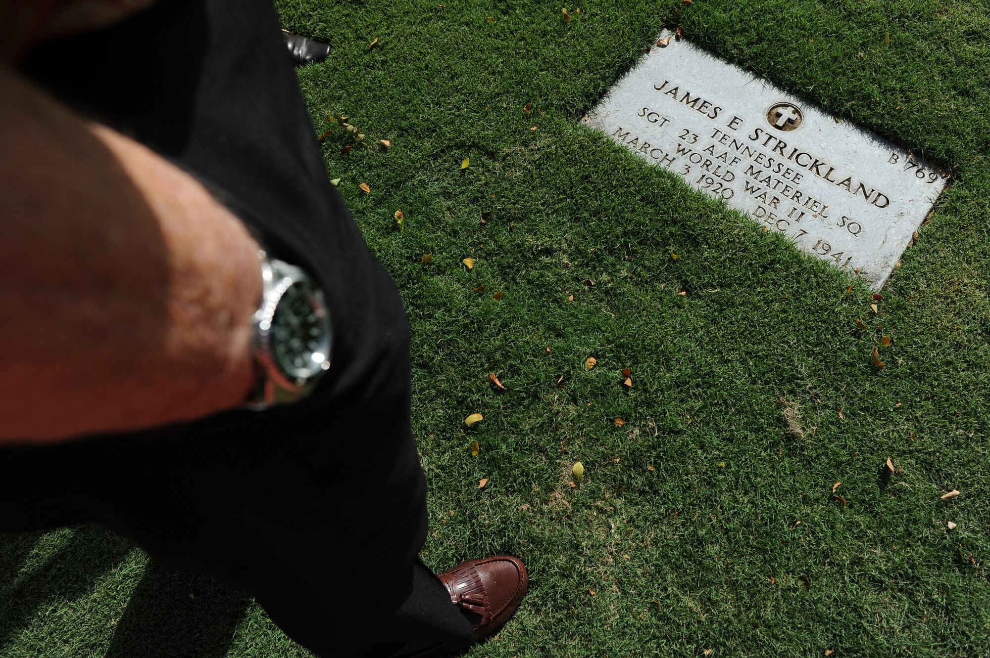 Durward Swanson, Dec. 7, 1941, Hickam Field survivor, look on the head stone of James E. Strickland at the National Memorial Cemetery of the Pacific, or Punchbowl National Cemetery, Nov. 22 during his visit to Hawaii. Swanson visited the base where 70 years ago he survived the sudden attack by the Japanese on Dec. 7, 1941. His friend Strickland was killed that day by a strafing Japanese plane in front of Swanson. (U.S. Air Force photo by Staff Sgt. Mike Meares)