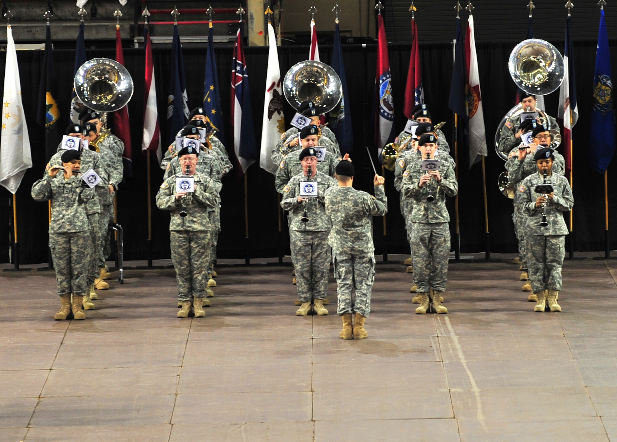 Soldiers of the 9th Army Band perform during the 4th Brigade Combat Team (Airborne), 25th Infantry Division deployment ceremony at Sullivan Arena, Anchorage, Alaska, Nov. 29, 2011. The 4-25 ABCT "Spartan Brigade" will deploy 3,500 Soldiers on a series of flights in November and December en route to Afghanistan. The 9th Army Band is assigned to Fort Wainwright, Alaska. (U.S. Air Force photo/Staff Sgt. Sheila deVera)