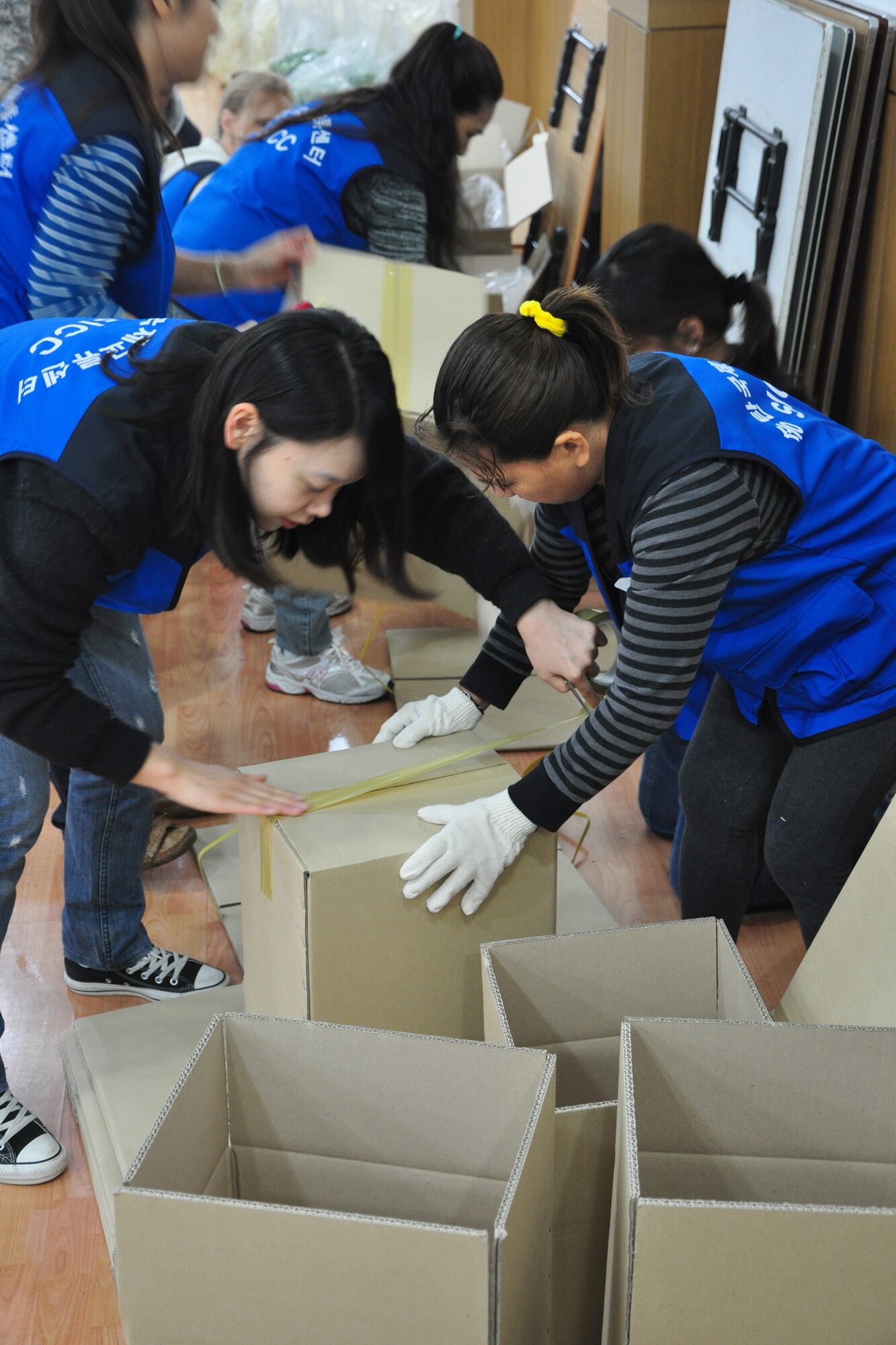 As part of the Good Neighbor Program, Osan and local community members came together Nov. 28 and 29 to prepare nearly 6,000 pounds of kimchi for the holidays in order to help those less fortunate in Songtan. About 200 volunteers helped chop, wash, prep, mix and box nearly 420, 15-pound boxes of kimchi, which will go to 420 local families. (U.S. Air Force photo/Tech. Sgt. Chad Thompson)