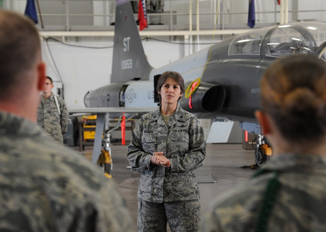 Lt. Col. Monica Madero, 364th Training Squadron commander, speaks with Airmen after they graduated from the Hydraulics Systems Apprentice course Nov. 23, 2011 at Sheppard Air Force base, Texas. With 49 academic days for each class and as many as 10 classes running concurrently, the course is scheduled to graduate approximately 420 students in fiscal year 2012. (U.S. Air Force photo/Senior Airman Adawn Kelsey)