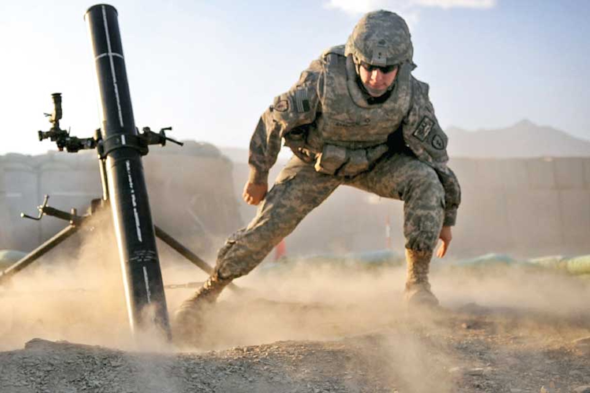 A Soldier from 4th Brigade Combat Team (Airborne) fires a mortar on Dec. 19, 2009,
during the brigade’s previous deployment to Afghanistan. (U.S. Army photo/Pfc. Andrya Hill)