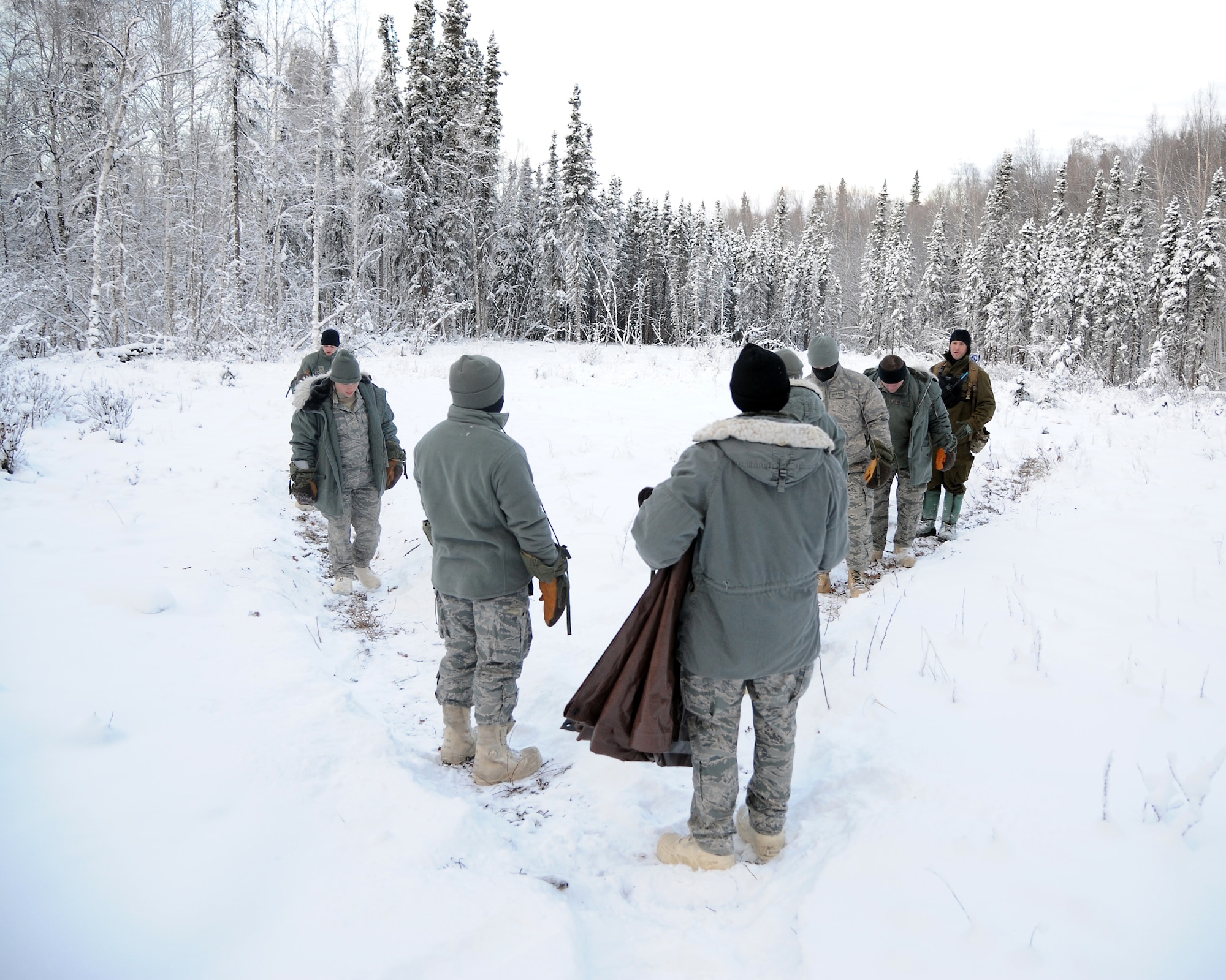 An Arctic Survival School class performs proper rescue recovery signal creation practices Nov. 9, 2011, Eielson Air Force Base, Alaska. (U.S. Air Force photo by Senior Airman Willard Grande II/Released)