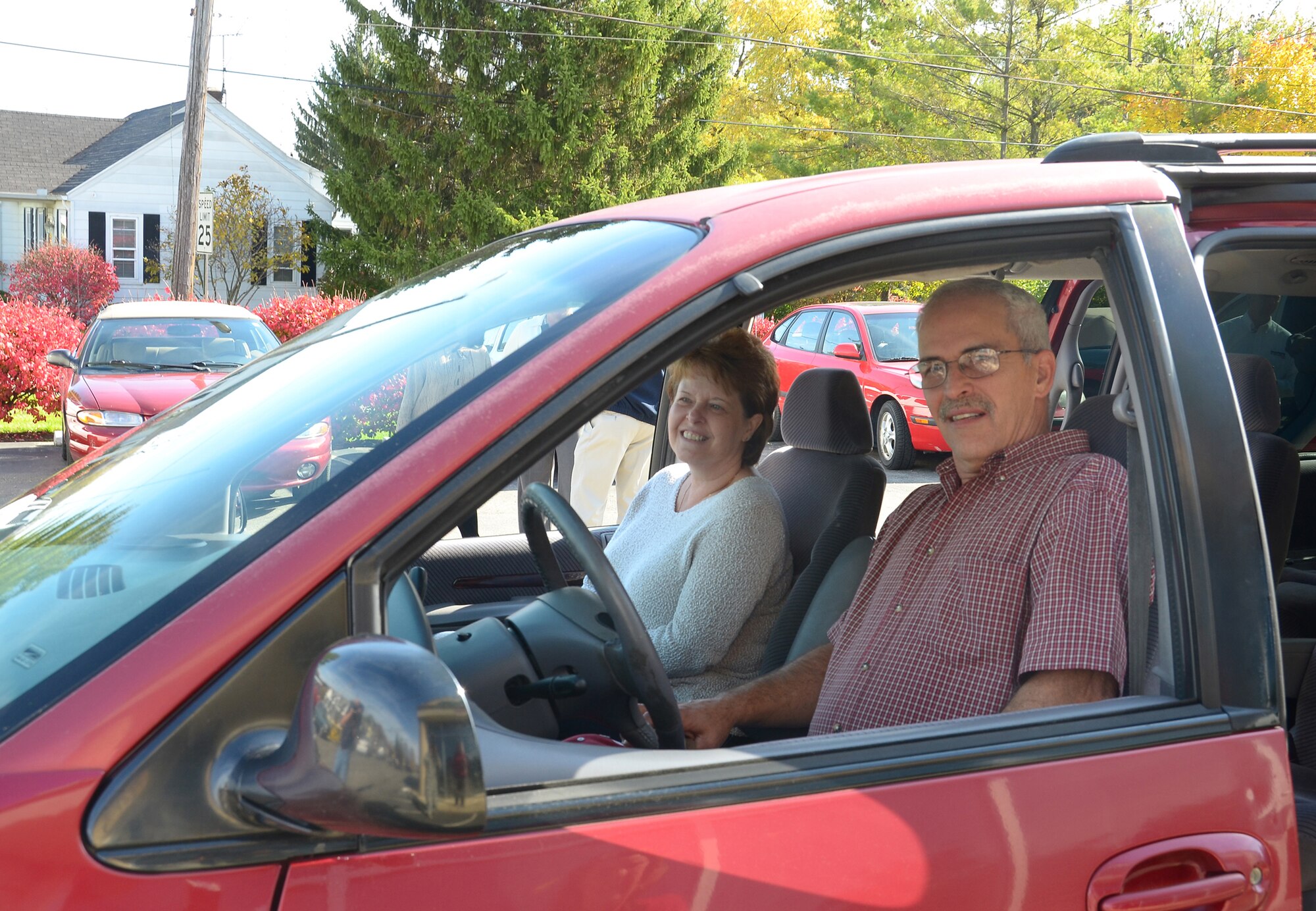 WRIGHT-PATTERSON AIR FORCE BASE, Ohio - Tech. Sgt. Robert Monti, 445th Maintenance Squadron machinist, and his wife, Sheri, enjoy their new vehicle presented to them Nov. 2 by Dave and Jan Murphy, owners of Murphy’s Autocare of Beavercreek, Ohio. (U.S. Air Force photo/Lt. Col. Cynthia Harris)