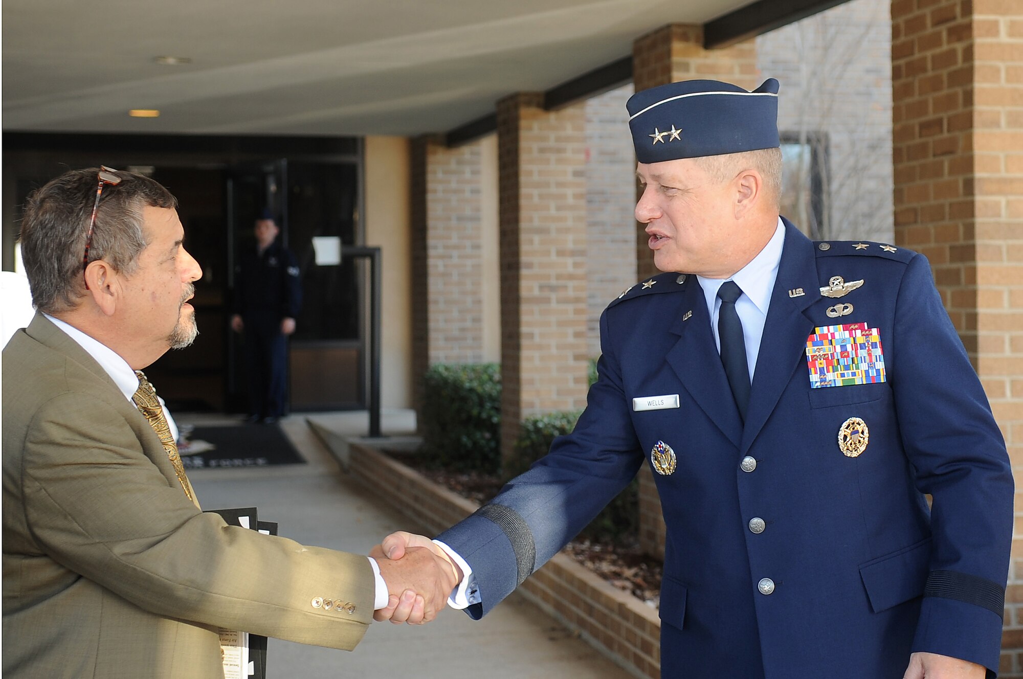 U.S. Air Force Maj. Gen Lawrence Wells, 9th Air Force Commander, welcomes Butch Wallace, District Director for the Second District in South Carolina, at Shaw Air Force Base, S.C., Nov. 28, 2011. Congressional leaders visited the base to better understand base operations, lifestyle, and the mission of Shaw which all Airmen and civilians make possible. (U.S. Air Force photo by Airman First Class Hunter Brady/Released)


