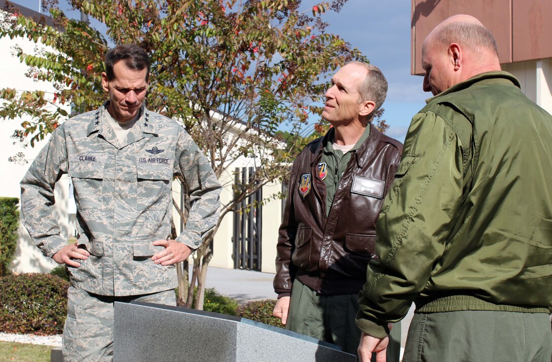 Gen. Mike Hostage (center), Air Combat Command commander, Lt. Gen. Sid Clarke (left), 1st Air Force commander, and U.S. Navy Capt. James Hineline, 601st Air and Space Operations Center deputy commander, examine the 9/11 Memorial on the 601st AOC compound at Tyndall Air Force Base, Fla., Nov. 29. Hostage visited several organizations at Tyndall during his two-day visit Nov. 28 and 29. (U.S. Air Force photo by Angela Pope) 