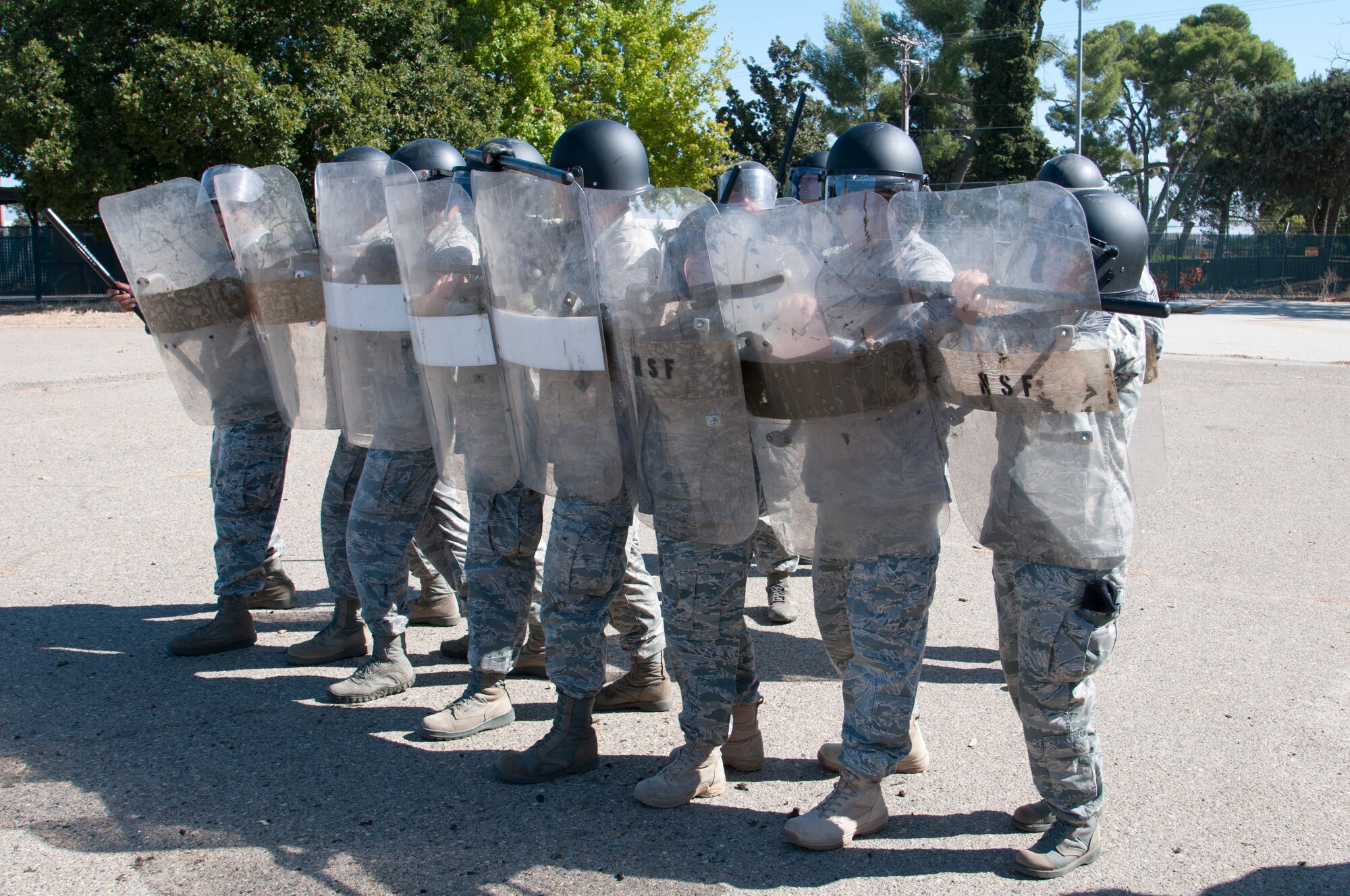 Members of the 144th Security Forces Squadron take part in specialized riot contol training. The special tactics are focused on crowd dispersement, force integrity and protection of assets.  (U.S. Air Force photo by Master Sgt. David Loeffler)