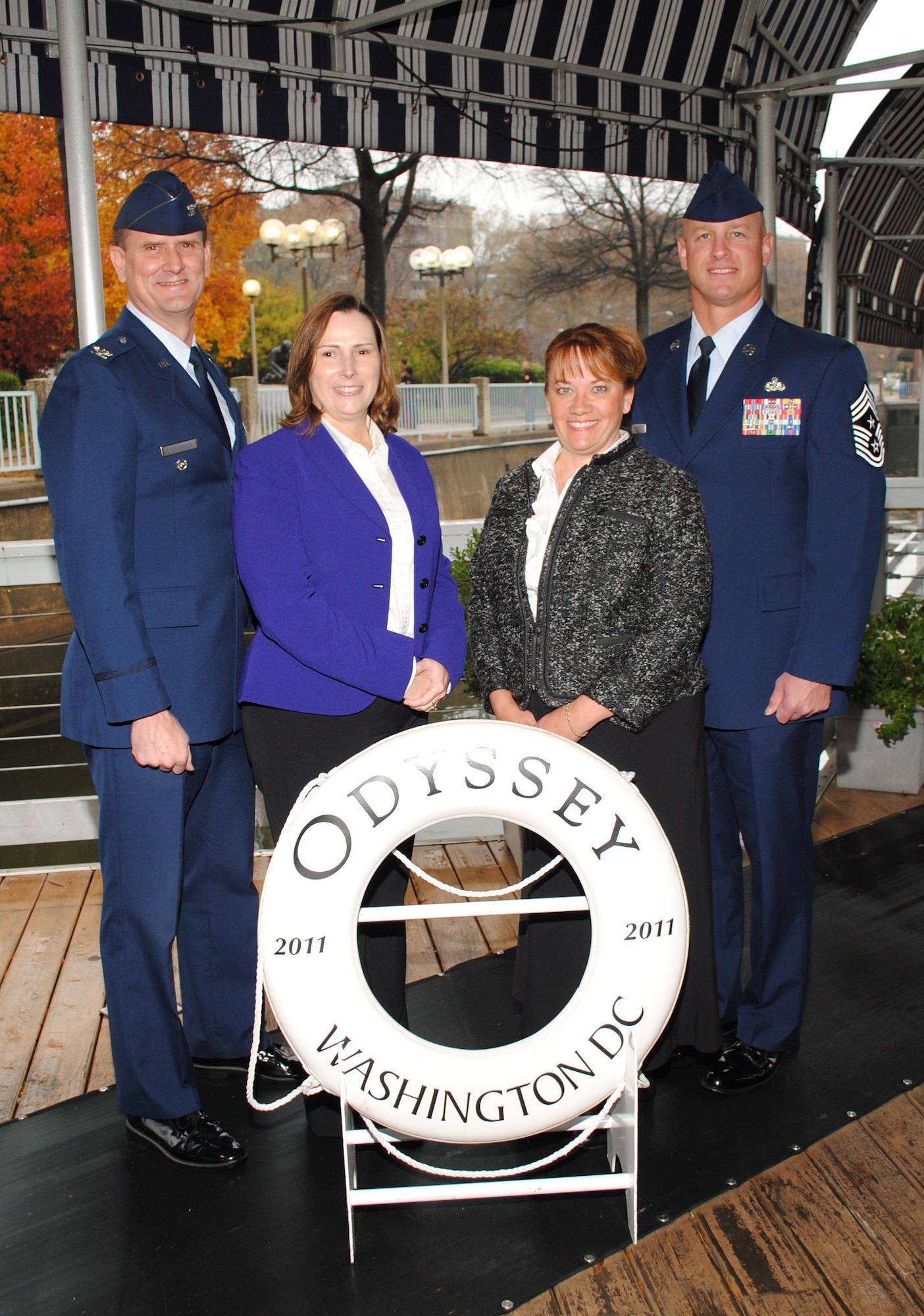 Col. and Mrs. Jeffrey L. Stephenson, Air Force District of Washington vice commander, and Chief Master Sgt. and Mrs. Scott A. Fuller, AFDW command chief, at the Odyssey Patriot Day cruise Nov. 22, Washington, D.C. AFDW leadership came to greet the veterans, Wounded Warriors and single Soldiers celebrating Thanksgiving aboard the ship. (Photo compliments of Odyssey Cruises)