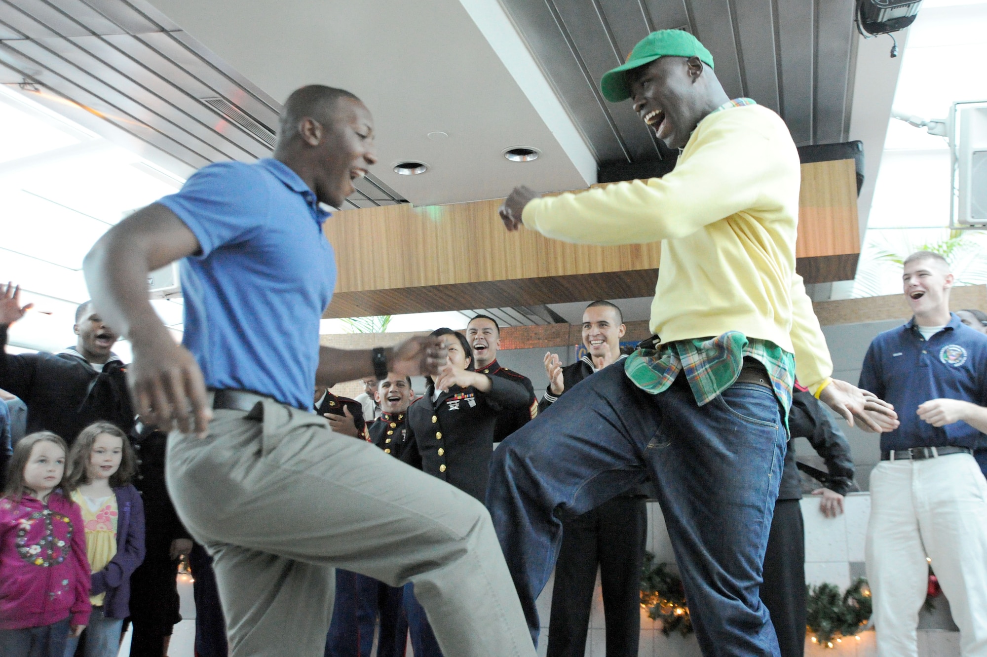 Single Soldiers break-it-down in a dance circle Nov. 22 aboard the Odyssey Patriot Day cruise, Washington, D.C. The Potomac River cruise provided dinner and dancing to veterans, Wounded Warriors and single Soldiers to celebrate Thanksgiving. (U.S. Air Force photo by Airman 1st Class Tabitha N. Haynes)