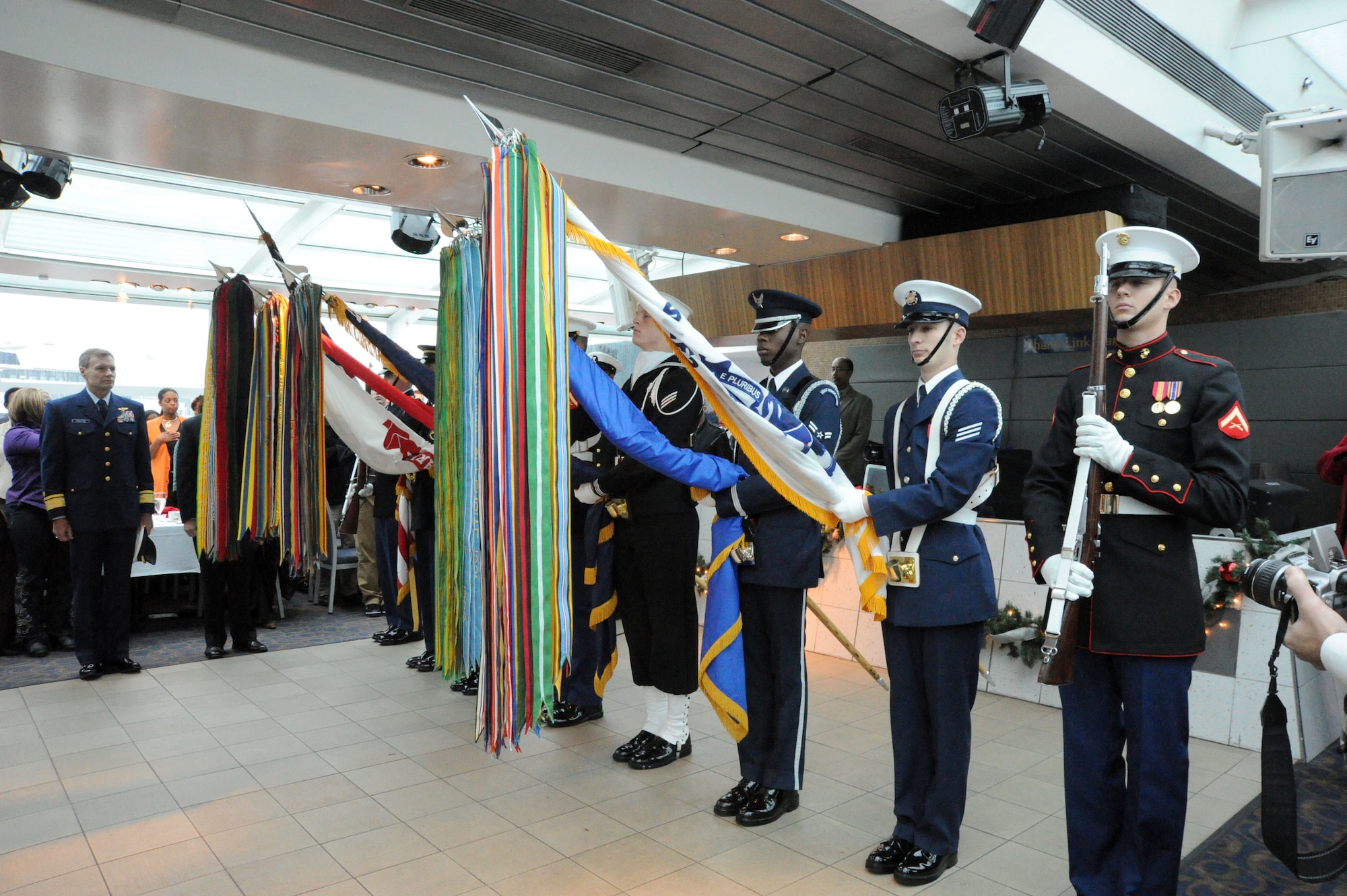 The Joint Services Color Guard present arms Nov. 22 aboard the Odyssey Patriot Day cruise, Washington, D.C. The Potomac River cruise provided dinner and dancing to veterans, Wounded Warriors and single Soldiers to celebrate Thanksgiving. (U.S. Air Force photo by Airman 1st Class Tabitha N. Haynes) 