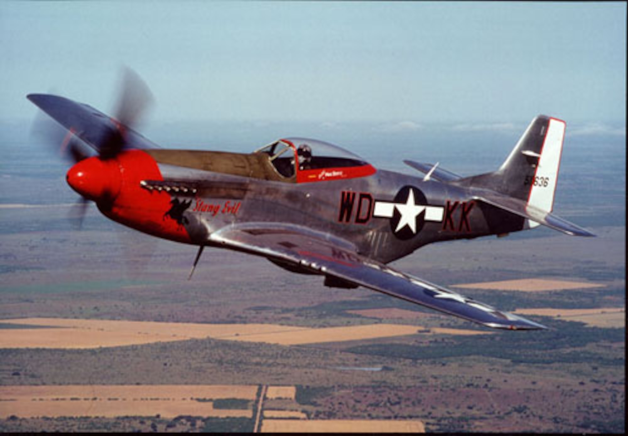 Retired Colorado Air National Guard Col. Michael W. Bertz pilots his P-51 Mustang, 'Stang Evil, circa May 2000. He was inducted into the Colorado Aviation Hall of Fame Oct. 2, 2011, at Wings Over the Rockies Air & Space Museum in Denver. (Photo provided by retired Col. Michael W. Bertz/Used with permission)