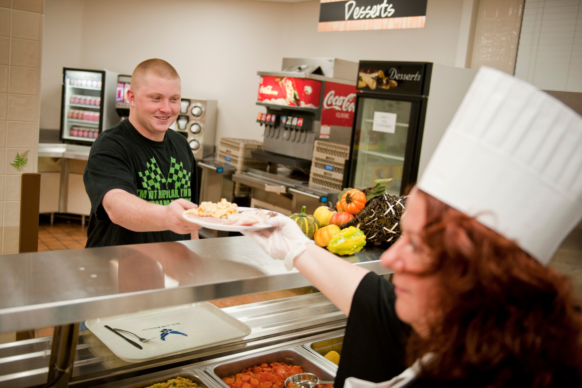 U.S. Air Force Airman 1st Class Tyler Persall receives his Thanksgiving meal at the Georgia Pines Dining Facility, Moody Air Force Base, Ga., Nov. 24, 2011. Persall is a heavy equipment operator with the 23rd Civil Engineer Squadron. It was his second Thanksgiving at Moody. (U.S. Air Force photo by Staff Sgt. Jamal D. Sutter/Released) 