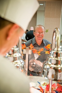 Lon Berresford, father of U.S. Air Force Airman 1st Class Morgan Berresford, chooses foods for his Thanksgiving meal at the Georgia Pines Dining Facility, Moody Air Force Base, Ga., Nov. 24, 2011. Airman Berresford is a food service journeyman with the 23rd Force Support Squadron. Lon traveled from East Palestine, Ohio, to spend Thanksgiving with his daughter. It was his third time visiting Moody. (U.S. Air Force photo by Staff Sgt. Jamal D. Sutter/Released)