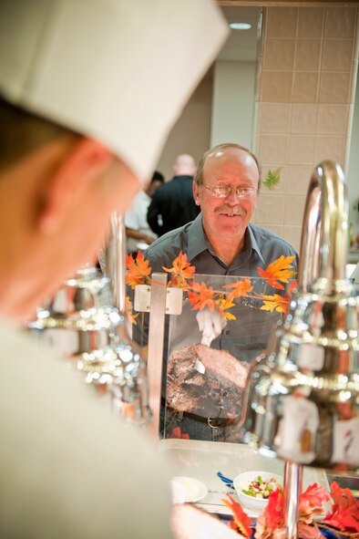Lon Berresford, father of U.S. Air Force Airman 1st Class Morgan Berresford, chooses foods for his Thanksgiving meal at the Georgia Pines Dining Facility, Moody Air Force Base, Ga., Nov. 24, 2011. Airman Berresford is a food service journeyman with the 23rd Force Support Squadron. Lon traveled from East Palestine, Ohio, to spend Thanksgiving with his daughter. It was his third time visiting Moody. (U.S. Air Force photo by Staff Sgt. Jamal D. Sutter/Released)