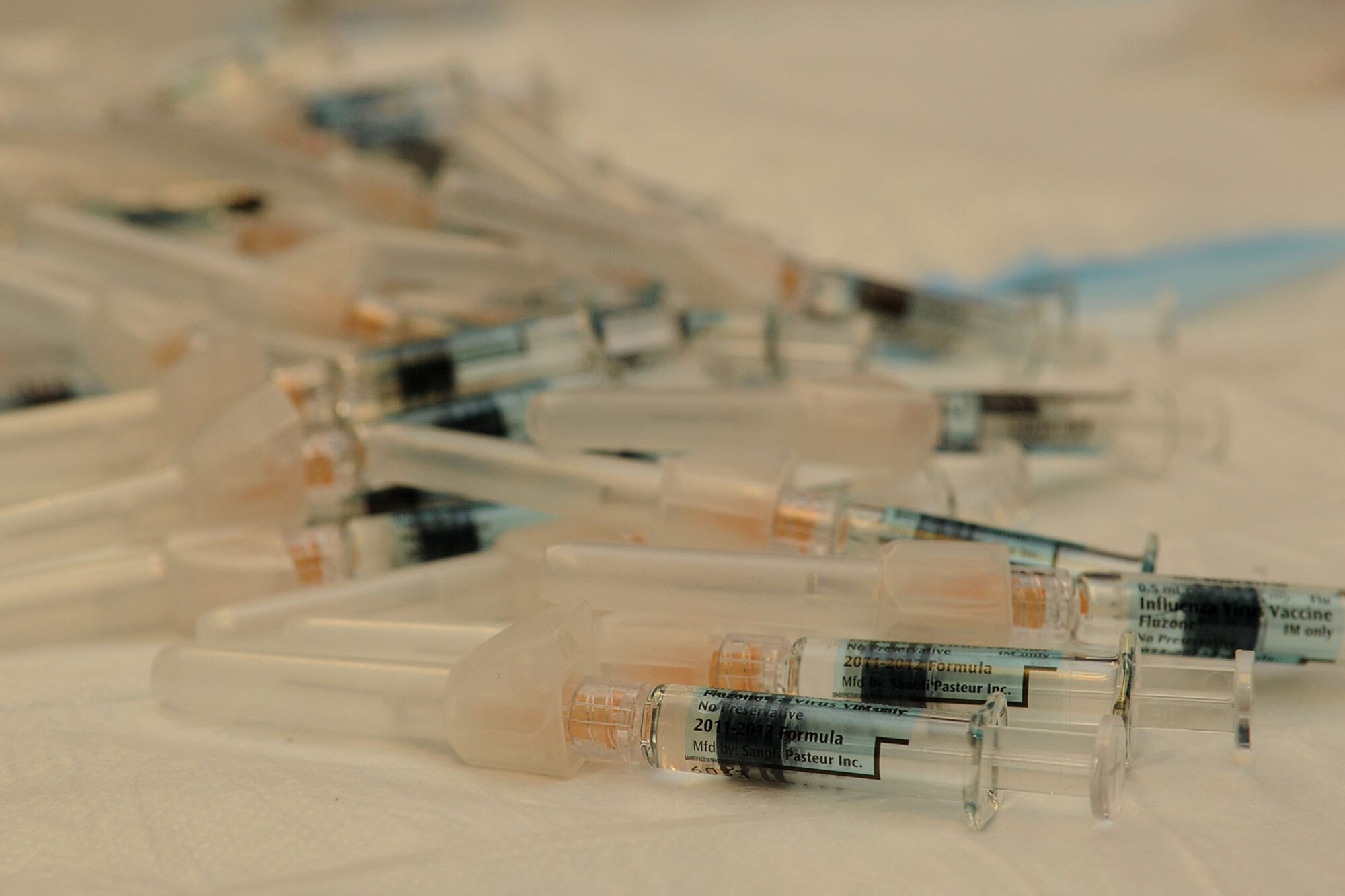 Members of Team Langley are provided influenza vaccines during a mass prophylaxis exercise at Langley Air Force Base, Va., Nov. 17, 2011. The annual Air Force-required full functional field exercise tested the group’s ability to respond to a pandemic flu outbreak. (U.S. Air Force photo by Airman 1st Class Racheal Watson/Released)