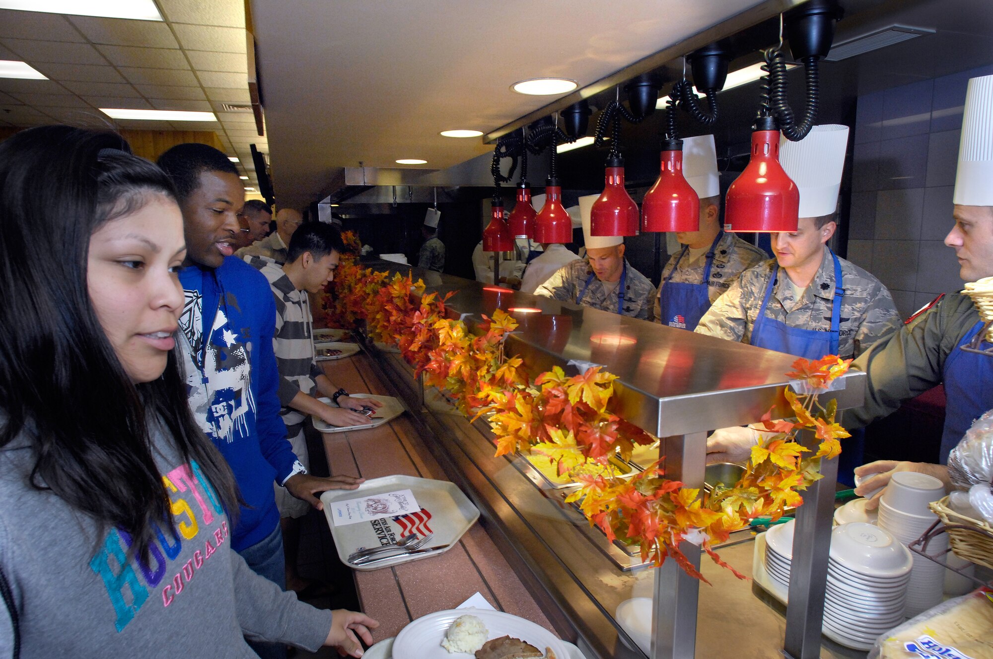 Airmen from the 56th Fighter Wing enjoyed a Thankgiving feast served by Wing leadership at Luke Air Force Base, Ariz., Nov 24, 2011. Group and Squadron commanders, Chief Master Sergeants and First Sergeants served the airman, retirees and their families throughout the meal. (U.S. Air Force photo by Staff Sgt. Jason Colbert)