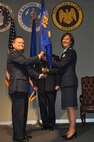 JOINT BASE ANDREWS, Md. -- Col. Samuel C. Mahaney, 459th Air Refueling Wing commander, passes the 459th Aeromedical Staging Squadron guidon to Col. Christine E. Bader during a change of command ceremony here Nov. 6. Colonel Bader takes command of the 459th ASTS after holding a position as an Individual Mobilization Augmentee to the Chief of Staff, Office of the Assistant Secretary of Defense for Health Affairs. (US Air Force photo/Senior Airman Russell)