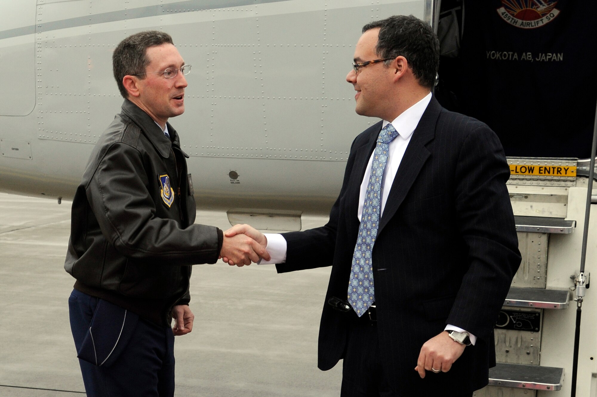 MISAWA AIR BASE, Japan - Col. Michael D. Rothstein, left, 35th Fighter Wing commander, greets Daniel B. Ginsberg, Assistant Secretary of the Air Force for Manpower and Reserve Affairs, upon his arrival here Nov. 28. Ginsberg stopped at Misawa Air Base to visit base facilities and to thank the Misawa community for their efforts during Operation Tomodachi. (U.S. Air Force photo/Tech. Sgt. Marie Brown)