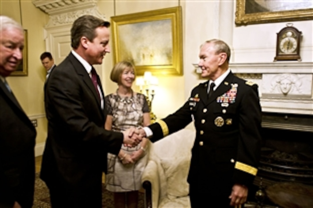U.S. Army Gen. Martin E. Dempsey, chairman of the Joint Chiefs of Staff, meets British Prime Minister David Cameron in London, Nov. 28, 2011.  