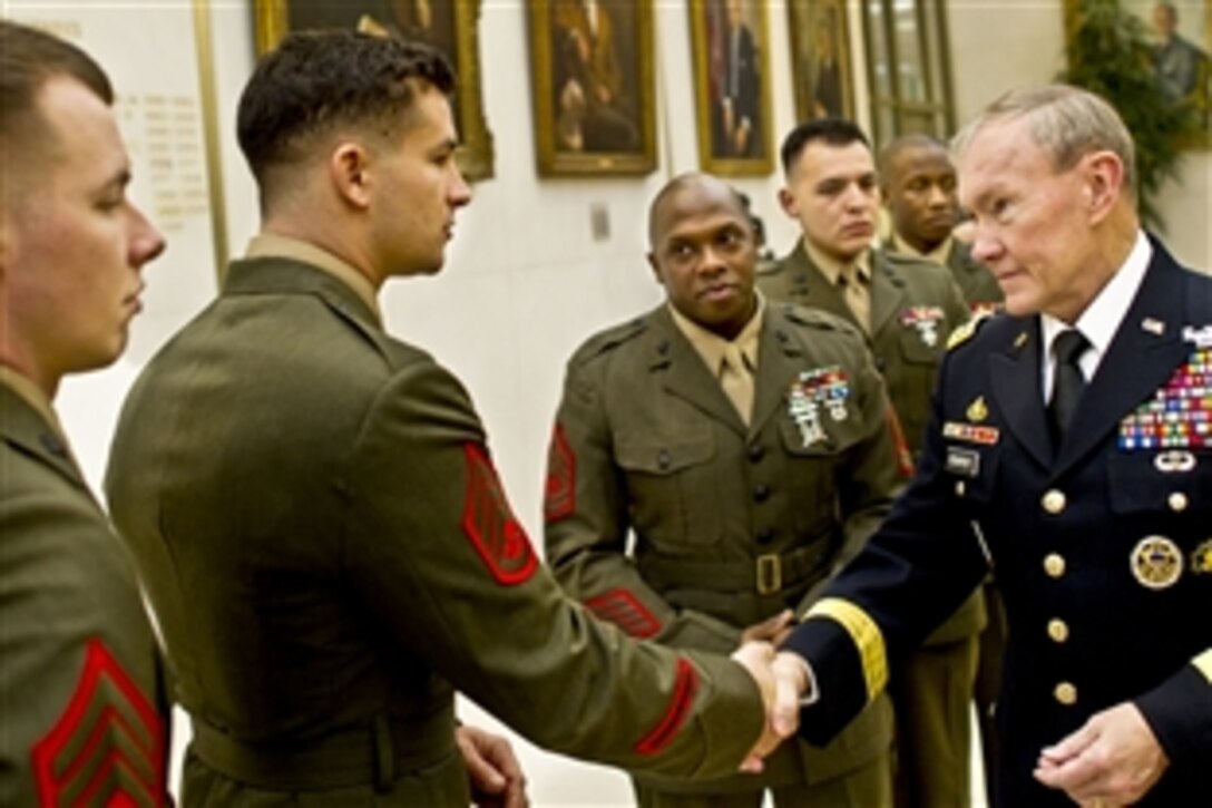 U.S. Army Gen. Martin E. Dempsey, chairman of the Joint Chiefs of Staff, meets with Marines stationed at the U.S. Embassy in London, Nov. 28, 2011.  