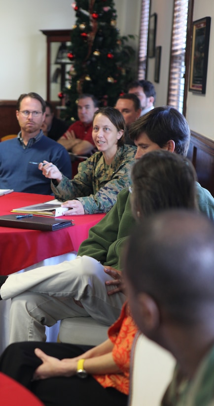 Sailors with the 2nd Marine Logistics Group listen as Sgt. Maj. Herbert W. Wrench, the 2nd MLG sergeant major, conducts a period of military education at the 2nd MLG Chaplain Center aboard Camp Lejeune, N.C., Nov. 30, 2011. During the PME, sailors with the various religious ministry teams across the unit learned the Marine Corps leadership traits and principles. (U.S. Marine Corps photo by Pfc. Franklin E. Mercado)