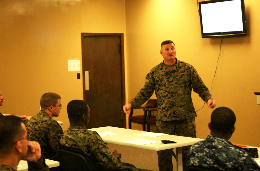 Sgt. Maj. Herbert W. Wrench, the 2nd Marine Logistics Group sergeant major, teaches a period of military education at the 2nd MLG Chaplain Center aboard Camp Lejeune, N.C., Nov. 30, 2011. During the PME, sailors with the religious ministry teams in the unit learned the Marine Corps leadership traits and principles. (U.S. Marine Corps photo by. Pfc. Franklin E. Mercado)