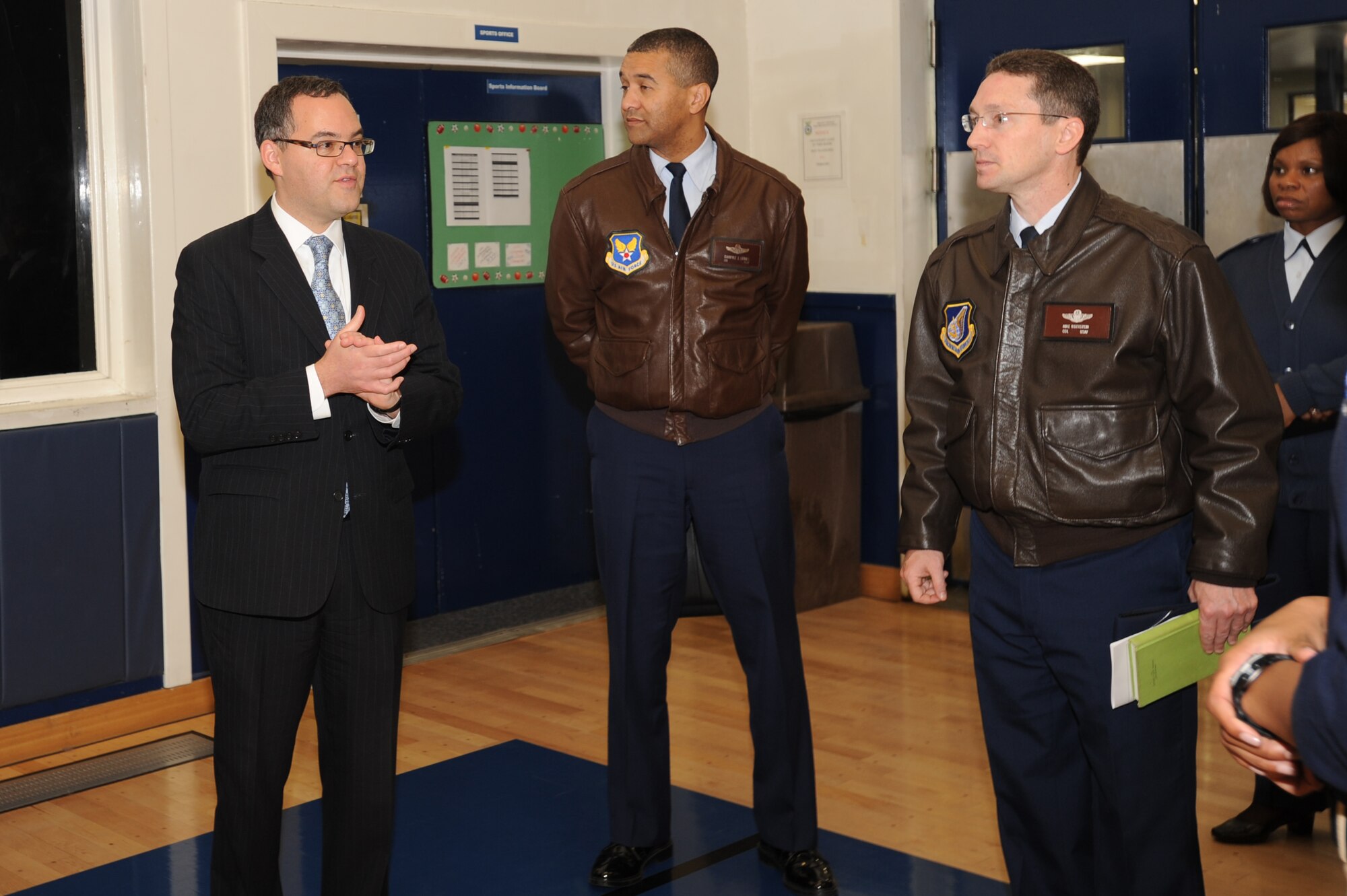 MISAWA AIR BASE, Japan -- Daniel B. Ginsberg, Assistant Secretary of the Air Force for Manpower and Reserve Affairs, (left), and Col. Darryle Grimes, Senior Military Assistant Secretary to Ginsberg, congratulates Col. Michael D. Rothstein, 35th Fighter Wing commander, on the overall appearance of the Potter Fitness Center here Nov. 28. Misawa was their first stop on a multi-base visit in the Pacific. Ginsberg toured the base and expressed his gratitude to the Misawa community for their efforts during Operation Tomodachi. (U.S. Air Force photo/ Airman Kenna Jackson)