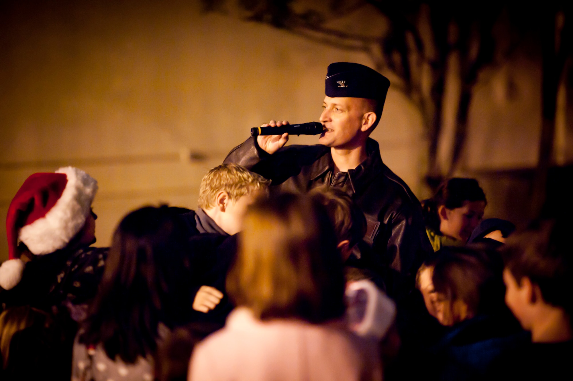 YOKOTA AIR BASE, Japan -- Col. Bill Knight, 374th Airlift Wing vice commander, counts down with a group of children to "flip the switch" for the annual tree lighting Nov. 30, 2011, at Yokota Air Base, Japan. (U.S. Air Force photo/Staff Sgt. Samuel Morse)