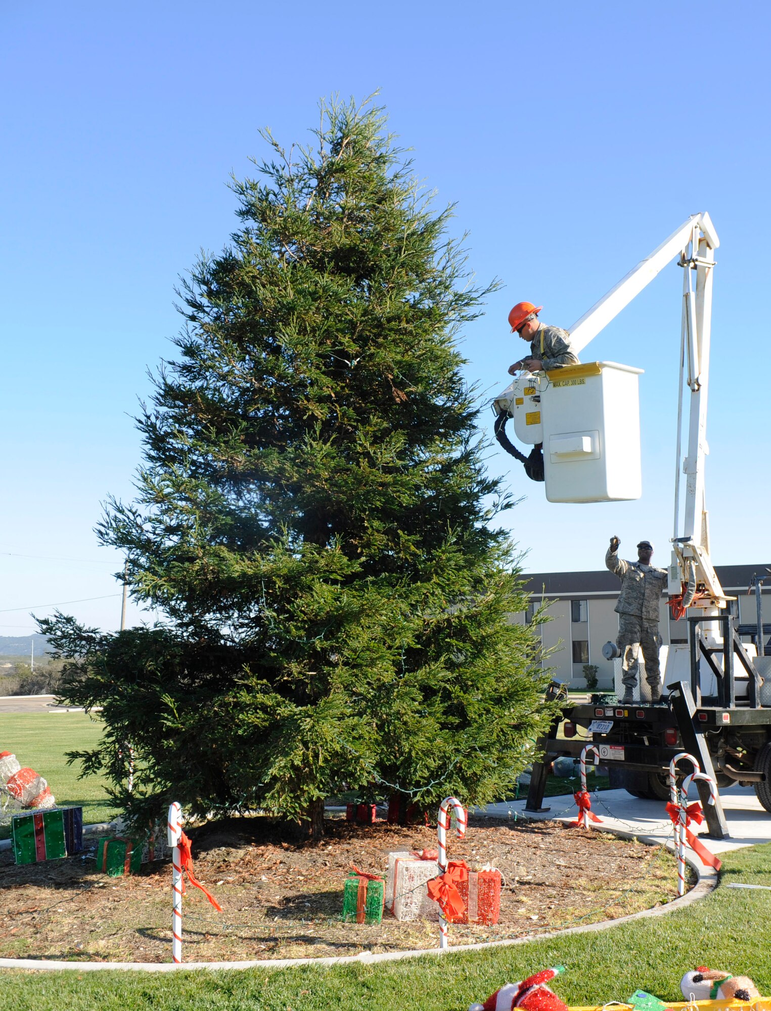VANDENBERG AIR FORCE BASE, Calif. -- Vandenberg Airmen began decorating for the holiday season here Wednesday, Nov. 30, 2011. Team Vandenberg personnel and their families are invited to attend the tree-lighting ceremony Tuesday, Dec. 6, 2011, at 4 p.m. in front of building 11777. (U.S. Air Force photo/Master Sgt. John Peters)