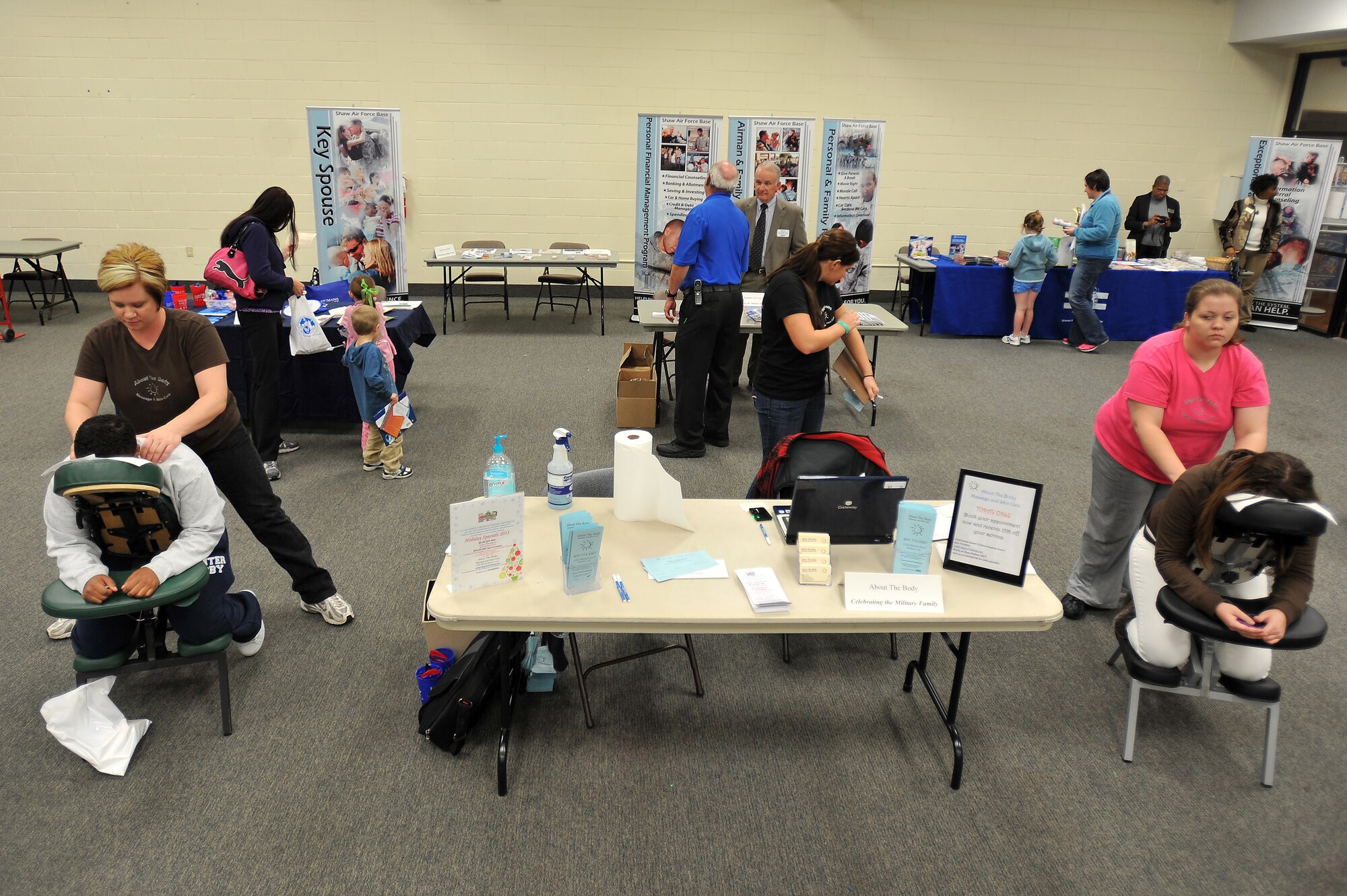 Military members and their families enjoy massages and other activities during a military family appreciation event hosted by Shaw?s Airman and Family Readiness Center, Nov. 29, 2011, Shaw Air Force Base, S.C. November marks military family appreciation month and to show their appreciation, the 20th Force Support Squadron Airman and Family Readiness Center organized an event which brought out several local Sumter vendors. There were more than 14 different vendors that provided military members and their families with free information and products. (U.S. Air Force photo by Senior Airman Kenny Holston/Released)


