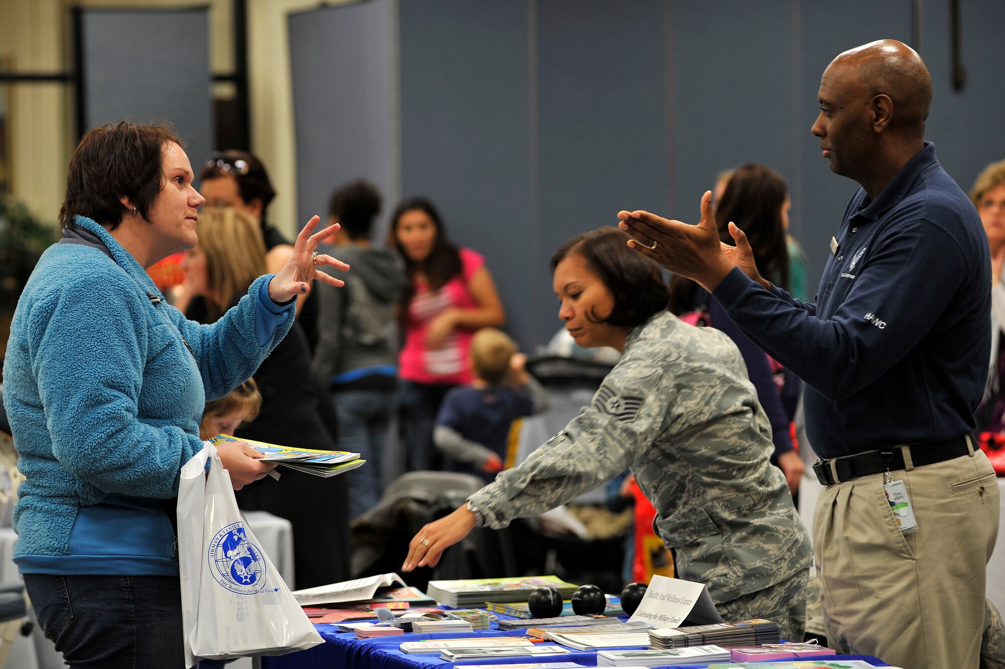 Jamie Killaly, wife of Maj. Michel Killaly, Third Army/United States Army Central Command, (left) talks with Lawrence Black, Health and Wellness fitness specialist, during a military family appreciation event hosted by Shaw?s Airman and Family Readiness Center, Nov. 29, 2011, Shaw Air Force Base, S.C. November marks military family appreciation month and to show their appreciation, the 20th Force Support Squadron Airman and Family Readiness Center organized an event which brought out several local Sumter vendors. There were more than 14 different vendors that provided military members and their families with free information and products. (U.S. Air Force photo by Senior Airman Kenny Holston/Released)


