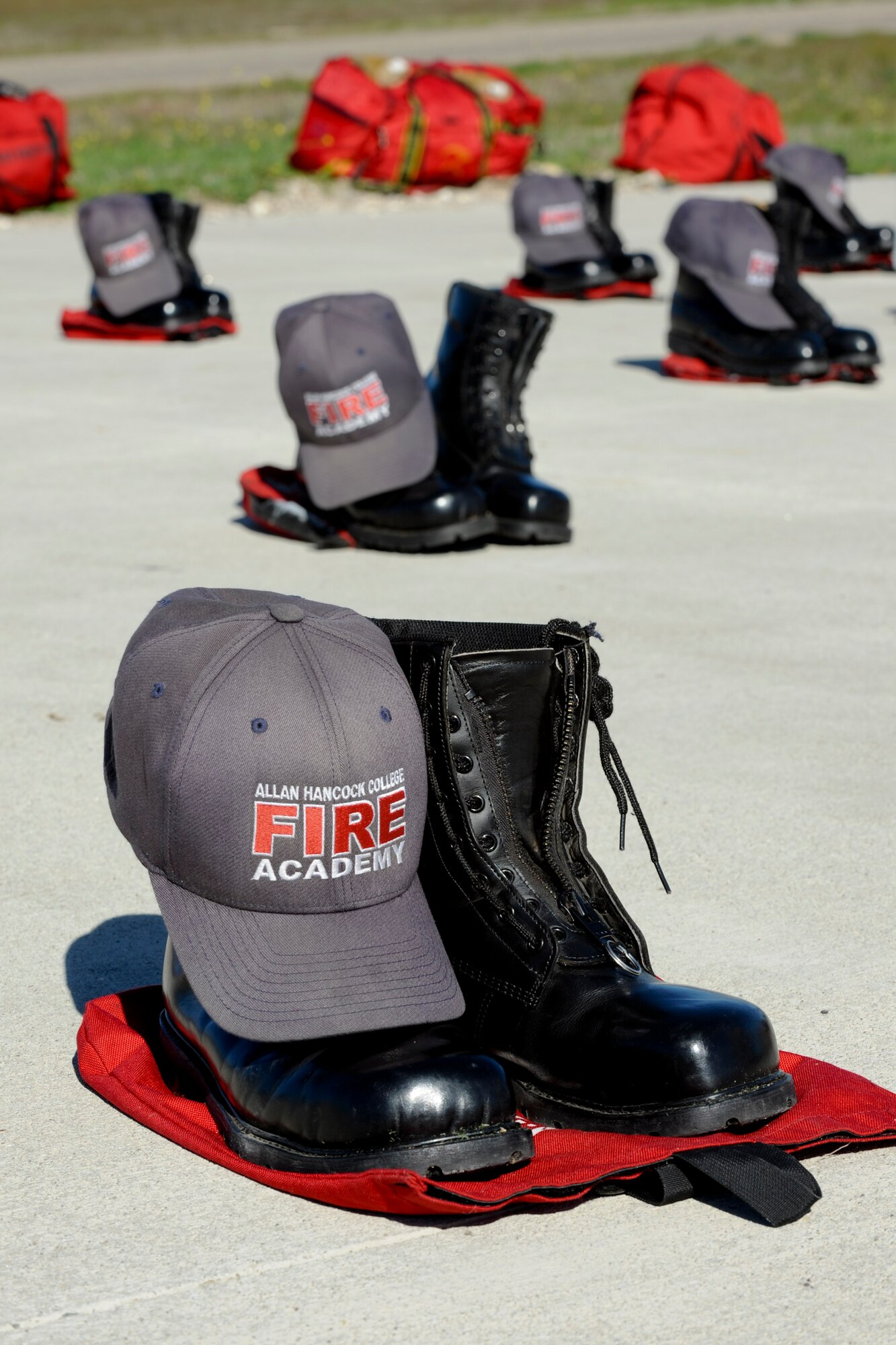 VANDENBERG AIR FORCE BASE, Calif. – Boots of firefighting students from Allen Hancock College Fire Academy sit while their owners put out fires during training at the Turner Bell Fire Training Campus here Wednesday, Nov. 30, 2011. Allen Hancock College students trained at Vandenberg to help build the required skills while their Public Safety Complex, which will incorporate skill training facilities, is under construction. (U.S. Air Force photo/Staff Sgt. Levi Riendeau)