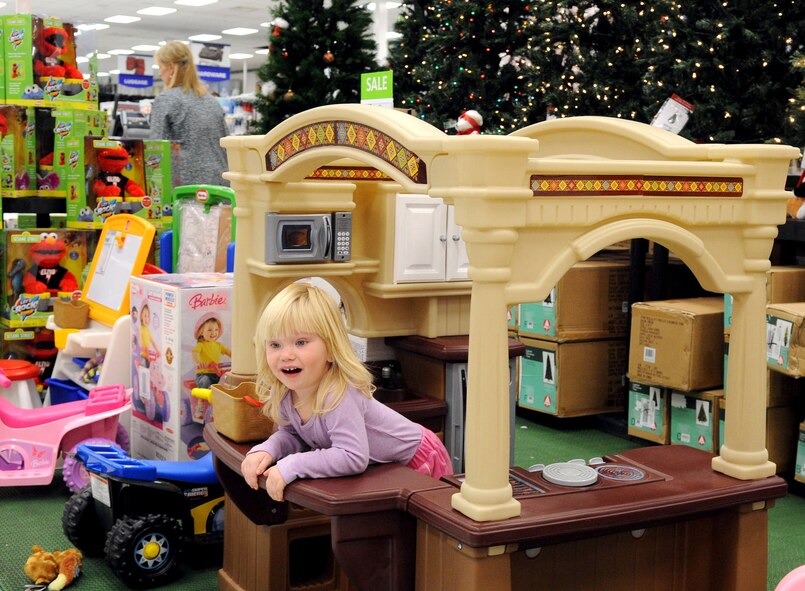 Chevie Crow, 2, daughter of Tech. Sgt. Clay Crow, Air Force Global Strike Command, plays in a toy kitchen at the Base Exchange on Barksdale Air Force Base, La., Nov. 30. With the expected holiday shopping rush, the BX will be open from 9 a.m. to 9 p.m. daily Dec. 1 through Dec. 23. (U.S. Air Force photo/Senior Airman La'Shanette V. Garrett)(RELEASED)