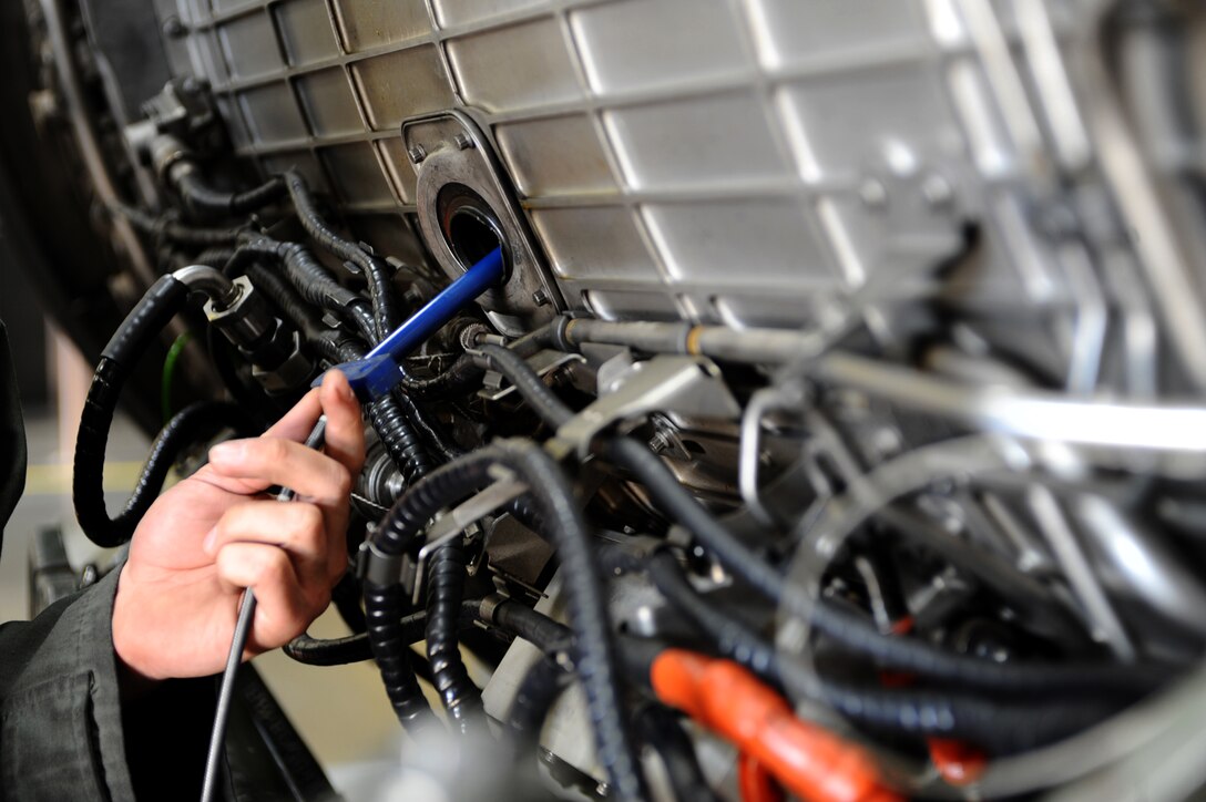 Senior Airman Steven Durr, 28th Maintenance Squadron aerospace propulsion journeyman, adjusts a boroscope camera in a General Electric F101-GE-102 turbofan engine at the propulsion flight building on Ellsworth Air Force Base, S.D., Nov. 29, 2011. The small flexible camera is used to inspect the engine interior without removing the outer casing. (U.S. Air Force photo by Airman 1st Class Zachary Hada/Released)