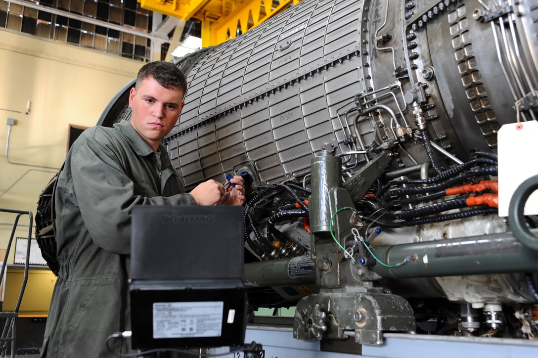 Senior Airman Steven Durr, 28th Maintenance Squadron aerospace propulsion journeyman, inspects the interior of a General Electric F101-GE-102 turbofan engine with a boroscope camera at the propulsion flight building on Ellsworth Air Force Base, S.D., Nov. 29, 2011. The boroscope allows Airmen like Durr to perform preventative maintenance inspections. (U.S. Air Force photo by Airman 1st Class Zachary Hada/Released)