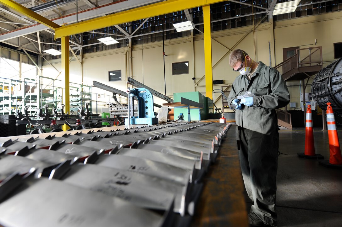 Airman 1st Class Christopher Thomas, 28th Maintenance Squadron aerospace propulsion apprentice, inspects and cleans second stage engine blades from a General Electric F101-GE-102 turbofan engine at the propulsion flight building on Ellsworth Air Force Base, S.D., Nov. 29, 2011. During the inspection, the mechanics have to check 88 blades, which allow the engine to produce more than 30,000 pounds of thrust. (U.S. Air Force photo by Airman 1st Class Zachary Hada/Released)