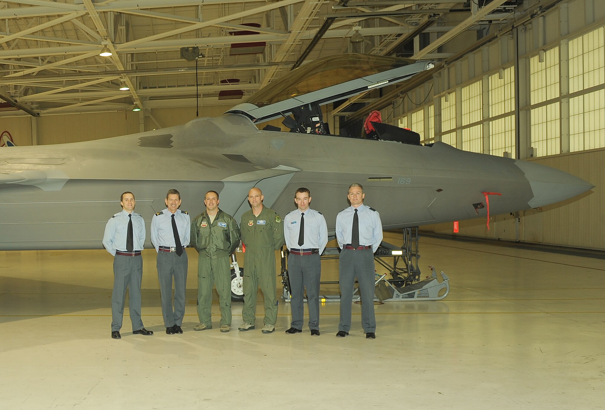 British Air Chief Marshal Sir Simon Bryant, the Royal Air Force’s Air Command commander-in-chief, views an F-22 Raptor at the 94th Fighter Squadron hangar during his visit to Langley Air Force Base, Va., Nov. 29, 2011. Bryant, who serves as the second-most senior officer in the RAF, visited several units at Langley, including the 94th FS and the 480th Intelligence, Surveillance and Reconnaissance Wing. (U.S. Air Force photo by Staff Sgt. Antoinette Gibson/Released)