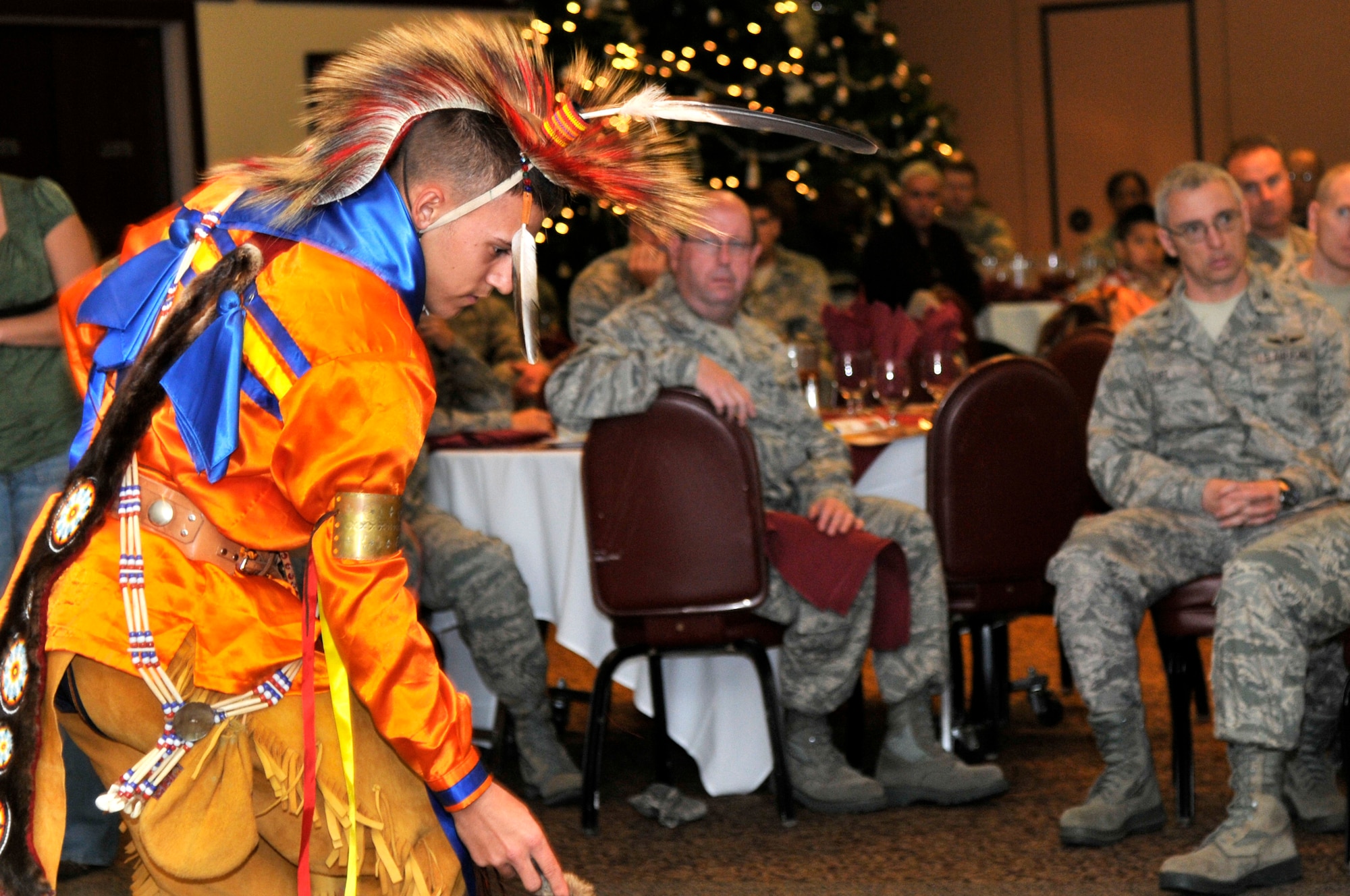 Airman 1st Class Jeremy Foreman, 9th Civil Engineering Squadron structures flight, performs a southern plains war dance for the Native American Heritage Month luncheon at the Recce Point Club Beale Air Force Base, Calif. Nov 29, 2011.  Foreman is representing the Choctaw people. (U.S. Air Force photo by Staff Sgt. Jeremy McGuffin/Released)
